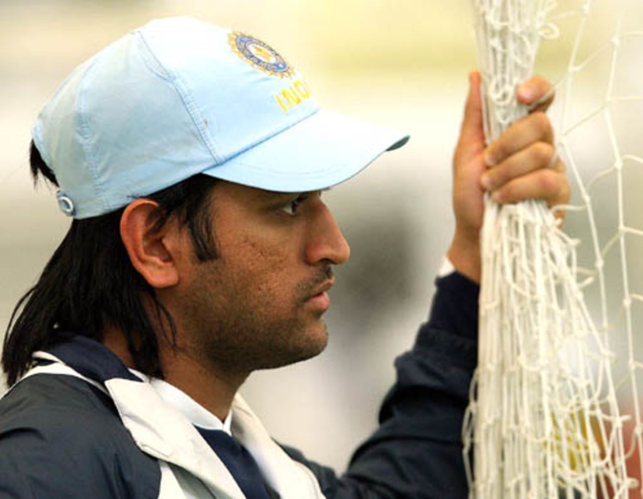 Mahendra Singh Dhoni looks on during an indoor practice session at the National Cricket Academy in Loughborough, July 26, 2007