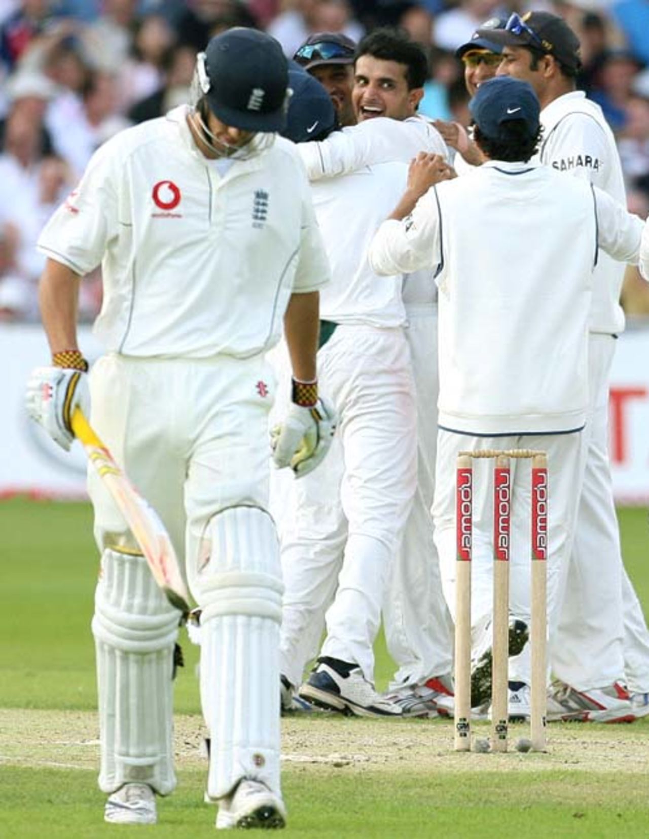 Alastair Cook walks off the field as the Indians mob Sourav Ganguly, England v India, 2nd Test, Trent Bridge, 1st day, July 27, 2007