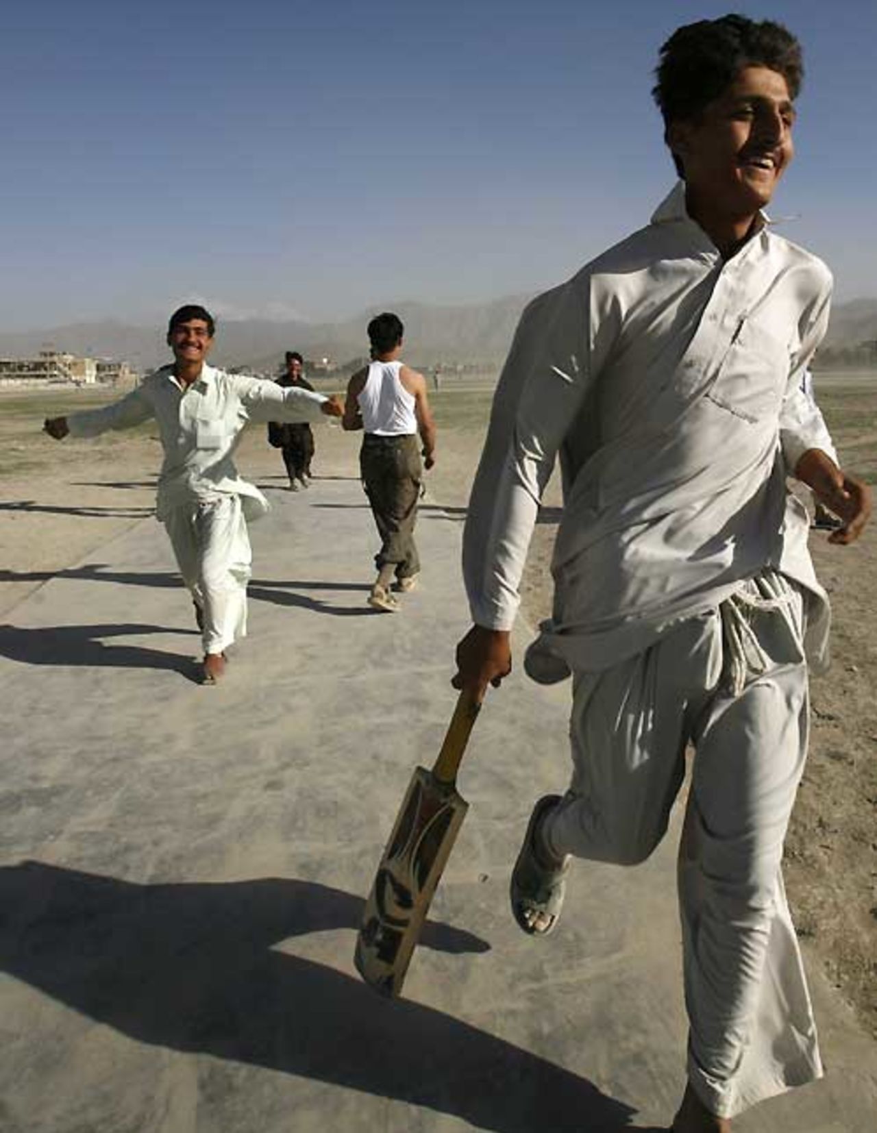 Cricket in Afghanistan - Players celebrate after winning a local league, Kabul, July 27, 2007