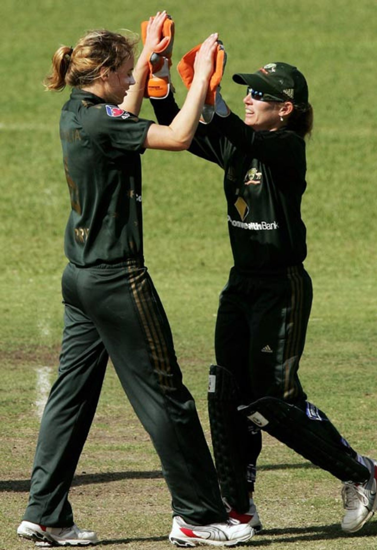 Ellyse Perry and Jodie Purves celebrate the fall of a New Zealand wicket, Australian women v New Zealand women, 5th ODI, Gardens Oval, Darwin, July 29, 2007