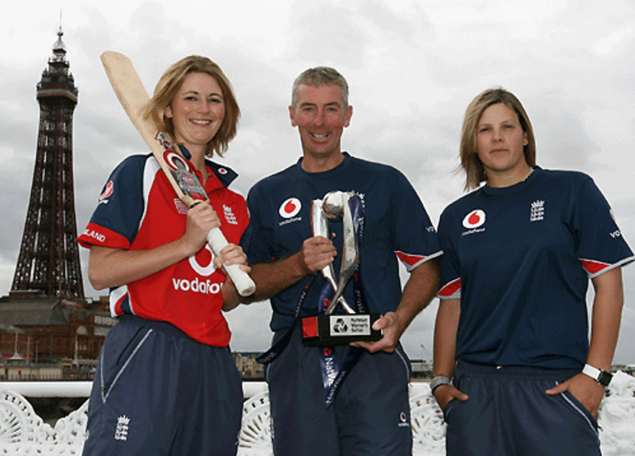 England captain Charlotte Edwards, coach Mark Dobson, and vice-captain Nicky Shaw with the NatWest Womens Series trophy in front of the Blackpool Tower, in Blackpool, August 2, 2007