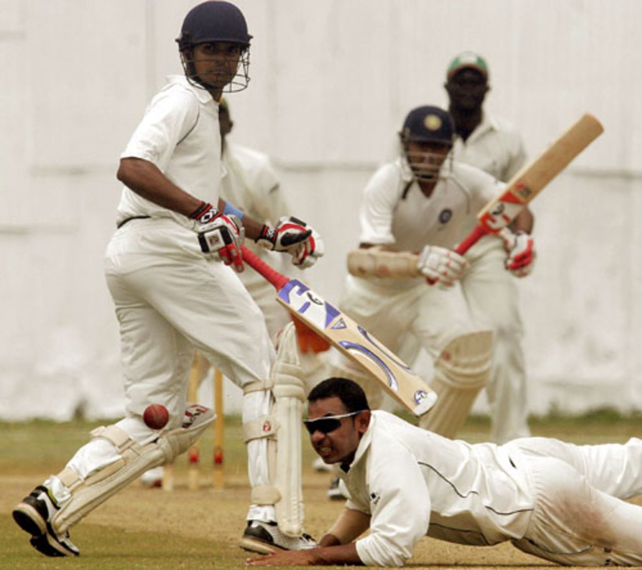 Parthiv Patel drives the ball past Hiren Varaiya as Subramaniam Badrinath looks on, Kenya v India A, Mombasa, 2nd day, August 11, 2007
