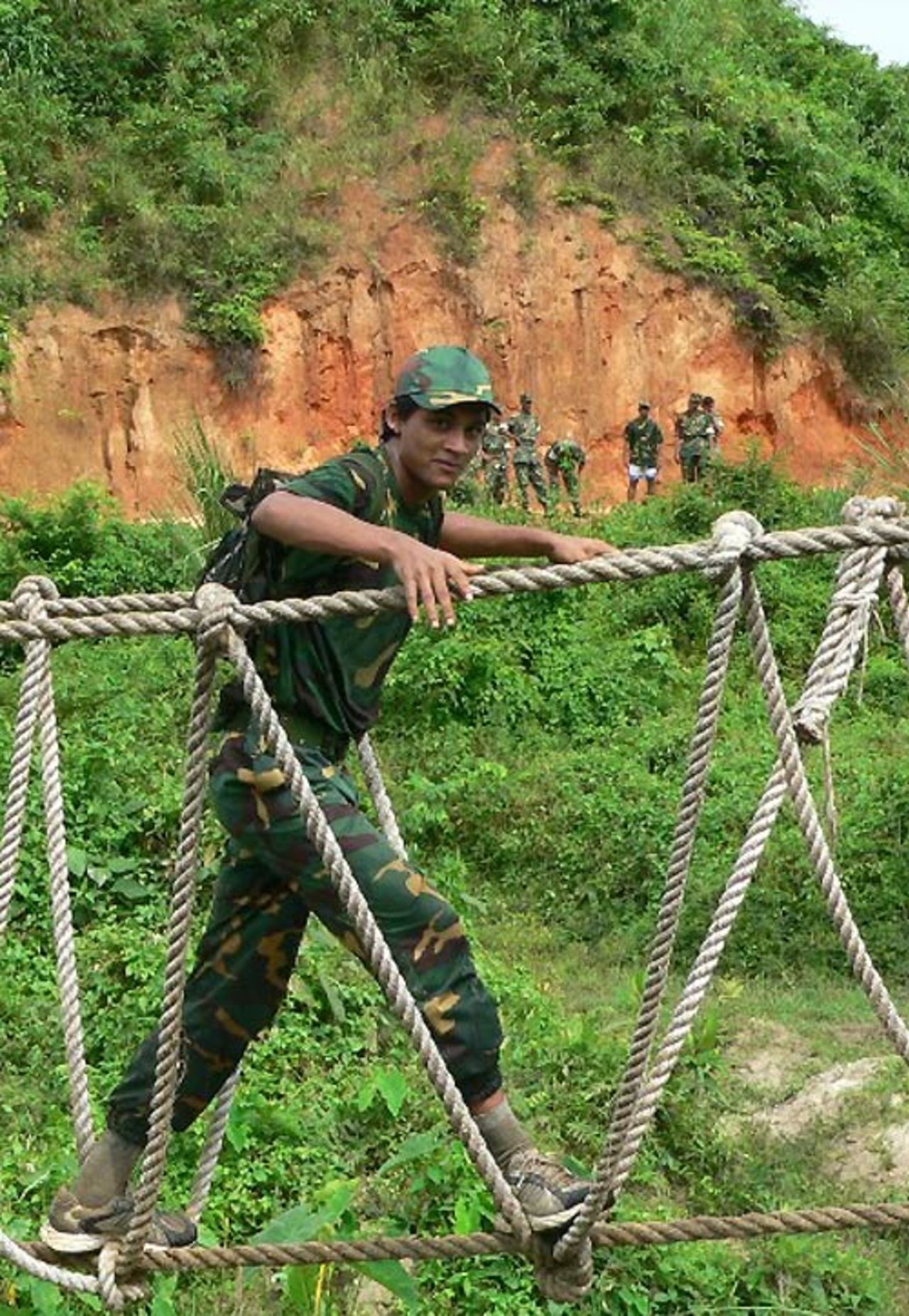 Nadif Chowdhury crosses a hanging bridge at the School of Infantry and Tactics, Sylhet, August 14, 2007 