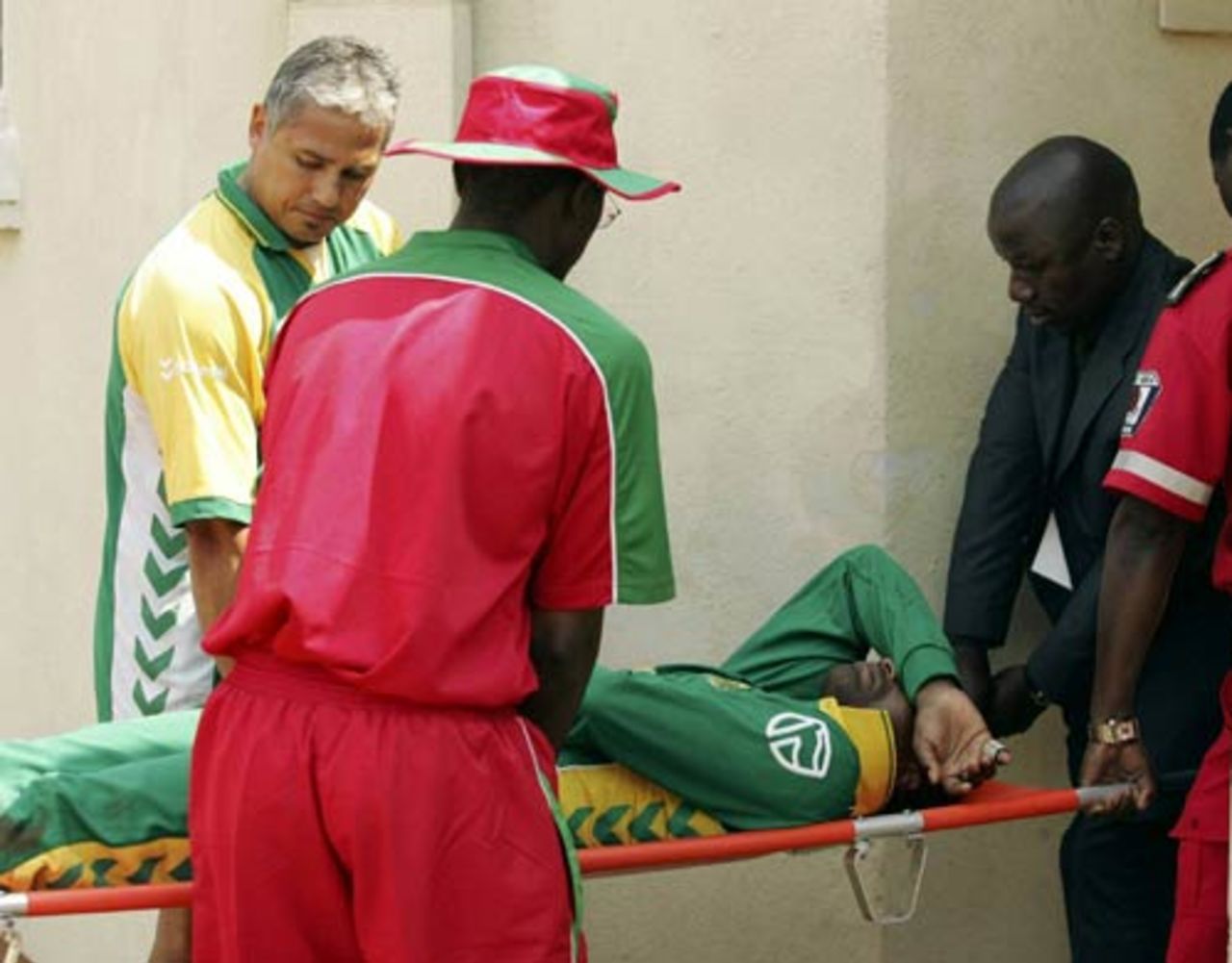 Loots Bosman is carried off after crashing into the advertising boards, Zimbabwe v South Africa, 2nd ODI, Harare, August 25, 2007