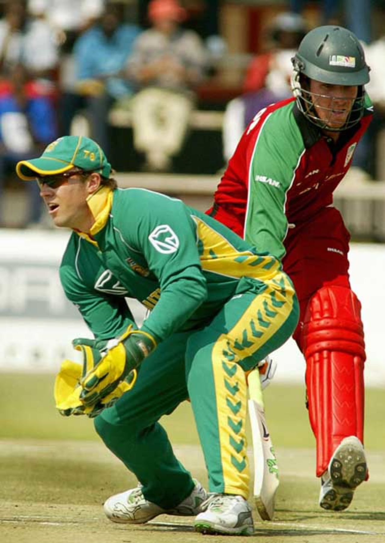 Brendan Taylor completes a run while AB De Villiers waits to collect the throw, Zimbabwe v South Africa, 2nd ODI, Harare, August 25, 2007