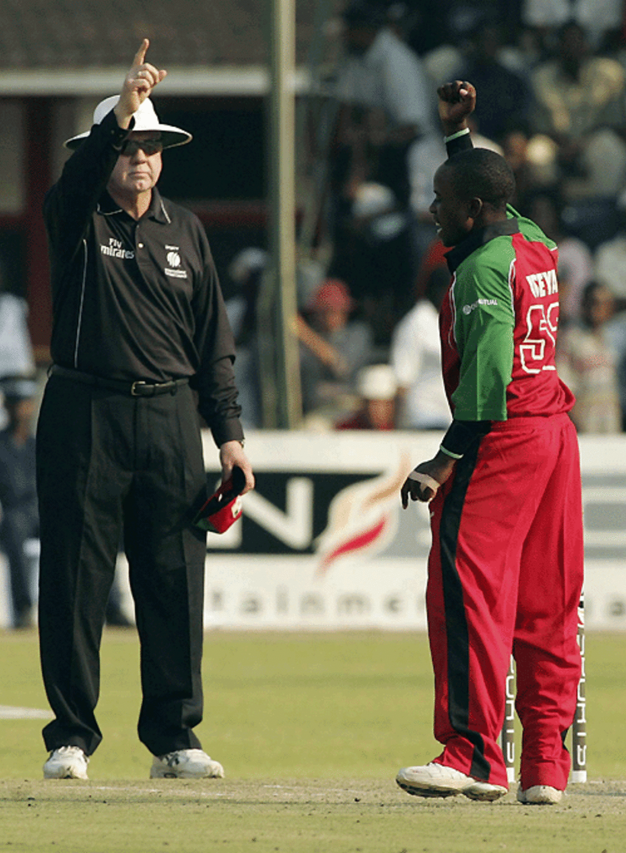 Umpire Steve Davis raises his finger to Prosper Utseya's appeal for Graeme Smith's wicket, Zimbabwe v South Africa, 2nd ODI, Harare, August 25, 2007