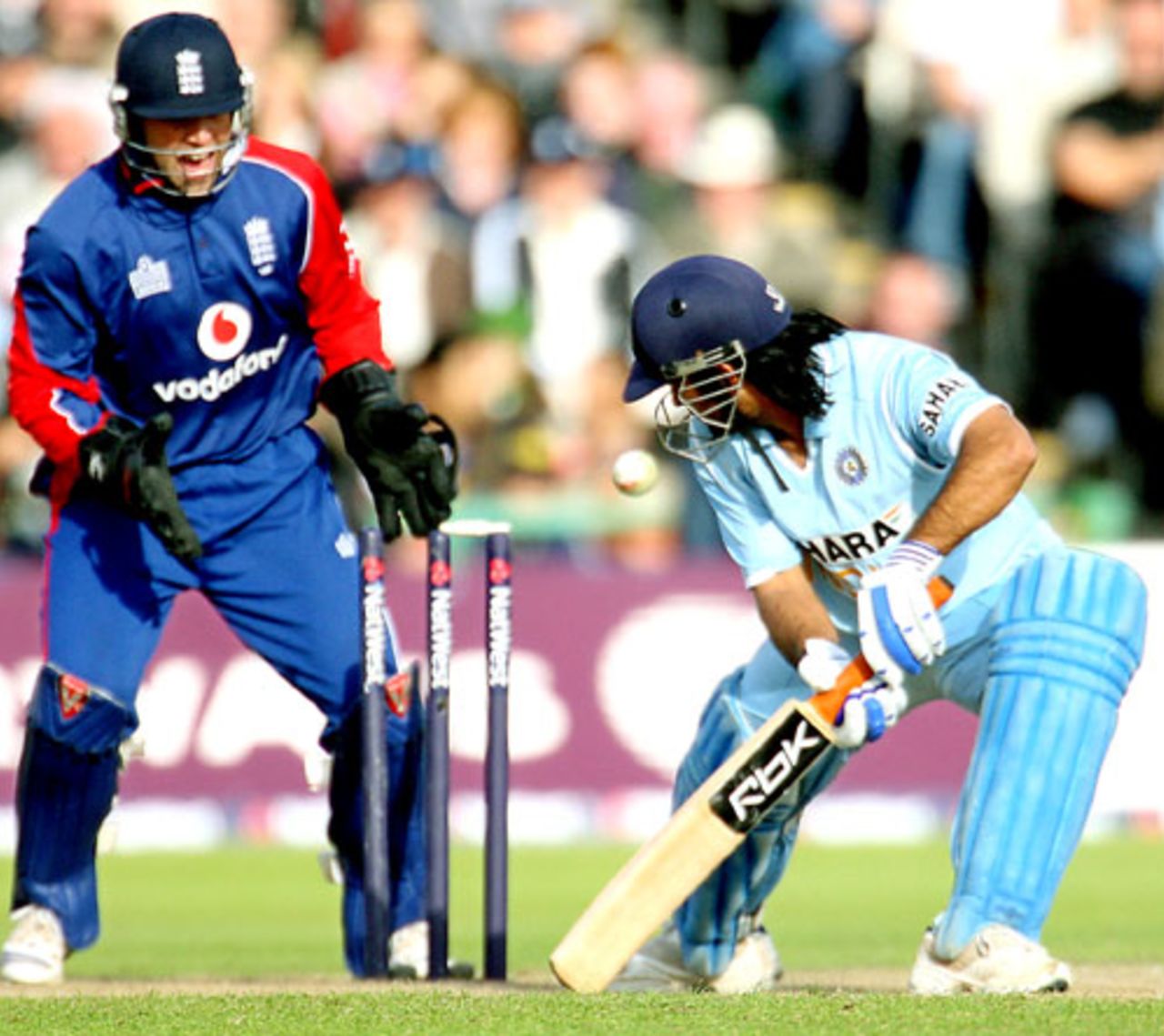 Mahendra Singh Dhoni is bowled by Monty Panesar, England v India, 4th ODI, Old Trafford, August 30, 2007
