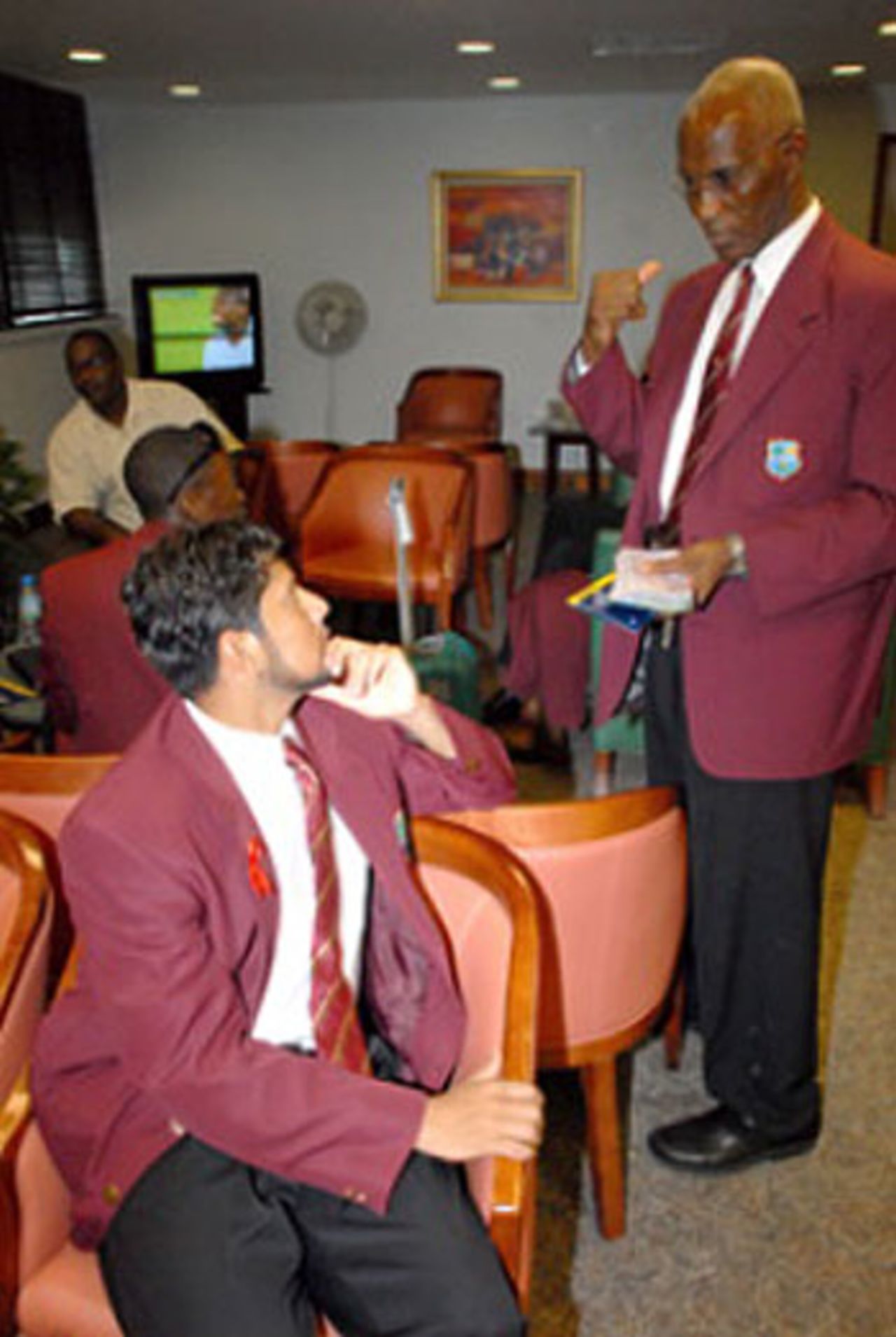 West Indies captain Ramnaresh Sarwan speaking to manager Mike Findlay as the side sets off for South Africa, Barbados, September 3, 2007