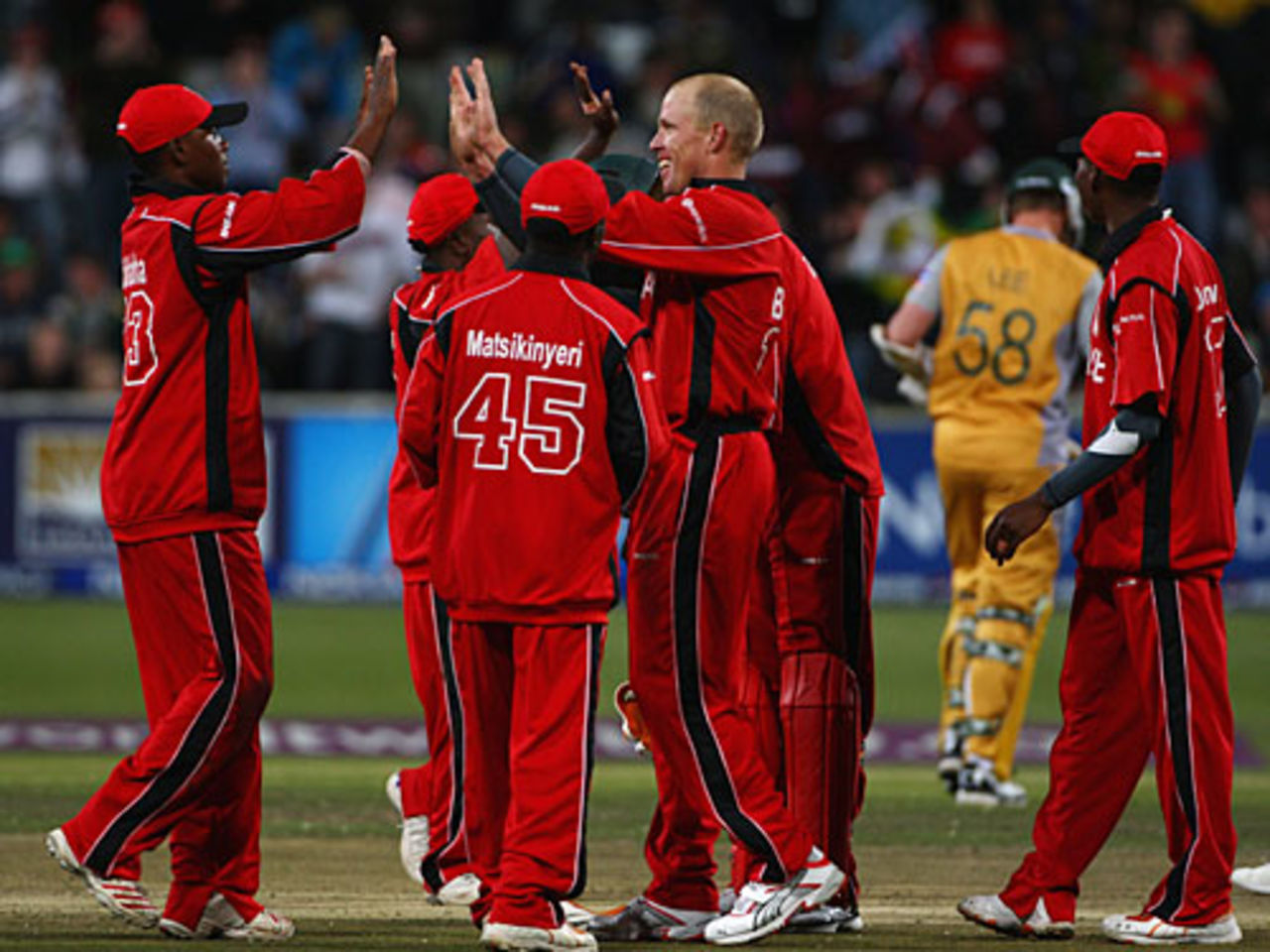 High fives for Gary Brent as Brett Lee heads off, Australia v Zimbabwe, Group B, ICC World Twenty20, Cape Town, September 12, 2007