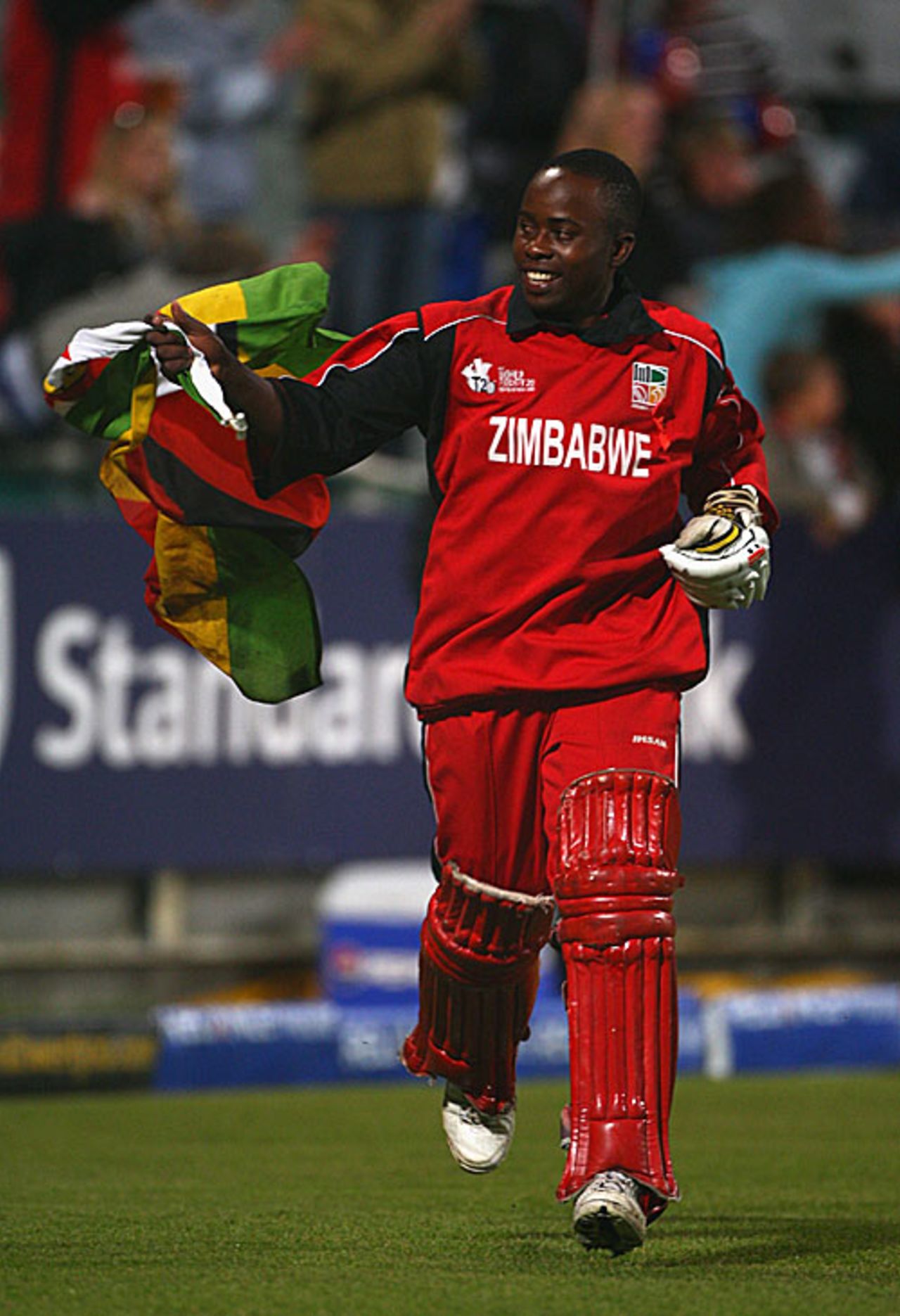 Prosper Utseya, the Zimbabwe captain, runs onto the field with the national flag, Australia v Zimbabwe, Group B, ICC World Twent20, Cape Town, September 12, 2007