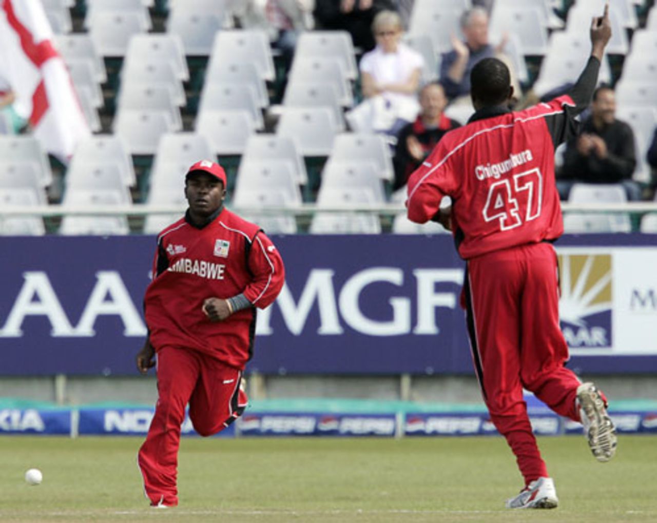 Elton Chigumbura and Stuart Matsikenyeri celebrate the dismissal of Darren Maddy, England v Zimbabwe, Group B, ICC World Twenty20, Cape Town, September 13, 2007