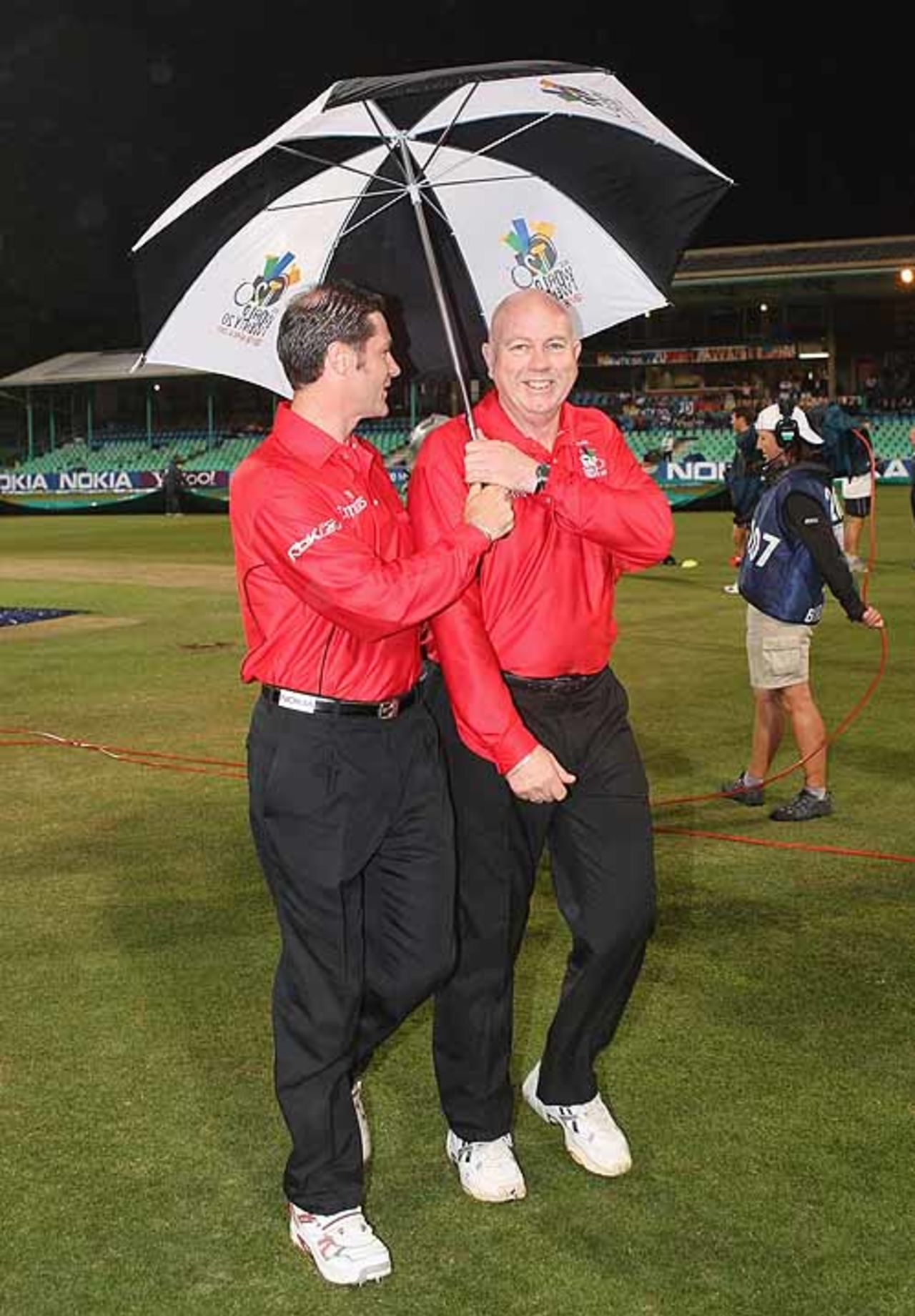 Simon Taufel and Steve Davis get some protection from the rain at Kingsmead, India v Scotland, Group D, ICC World Twenty20, Durban, September 13, 2007