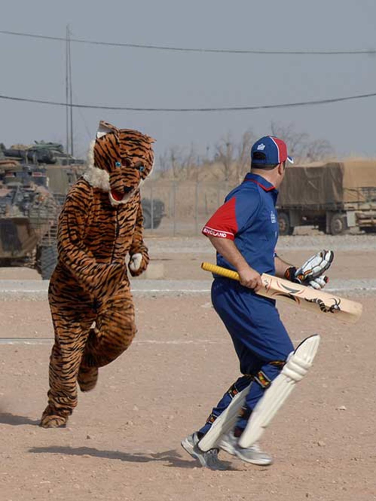 England's outgoing batsman is chased from the crease by the team mascot, Basra Ashes, England XI v Australia XI, September 14, 2007