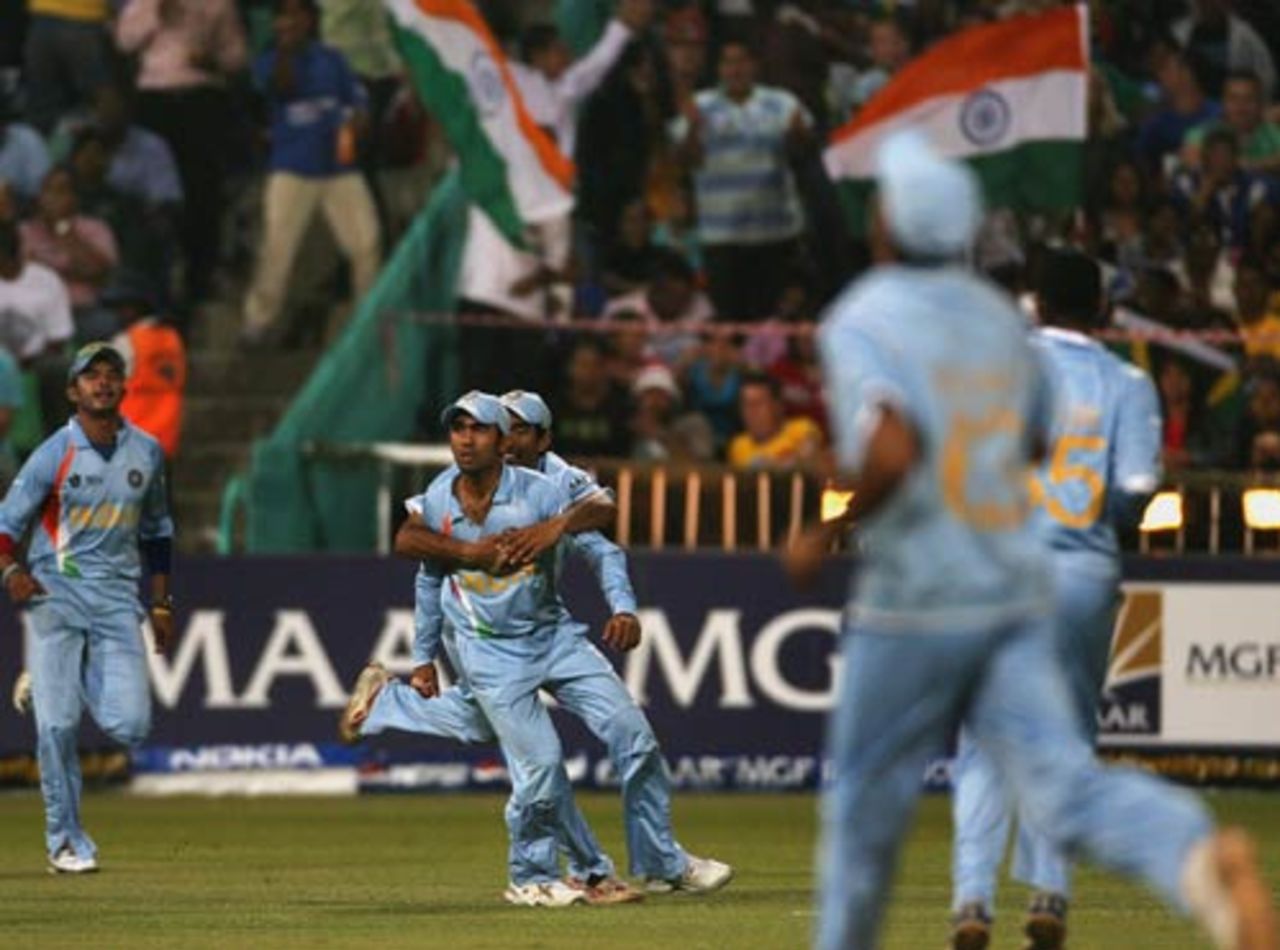 Dinesh Karthik is mobbed by team-mates after he took a stunner to dismiss Graeme Smith, India v South Africa, Group E, ICC World Twenty20, Durban, September 20, 2007