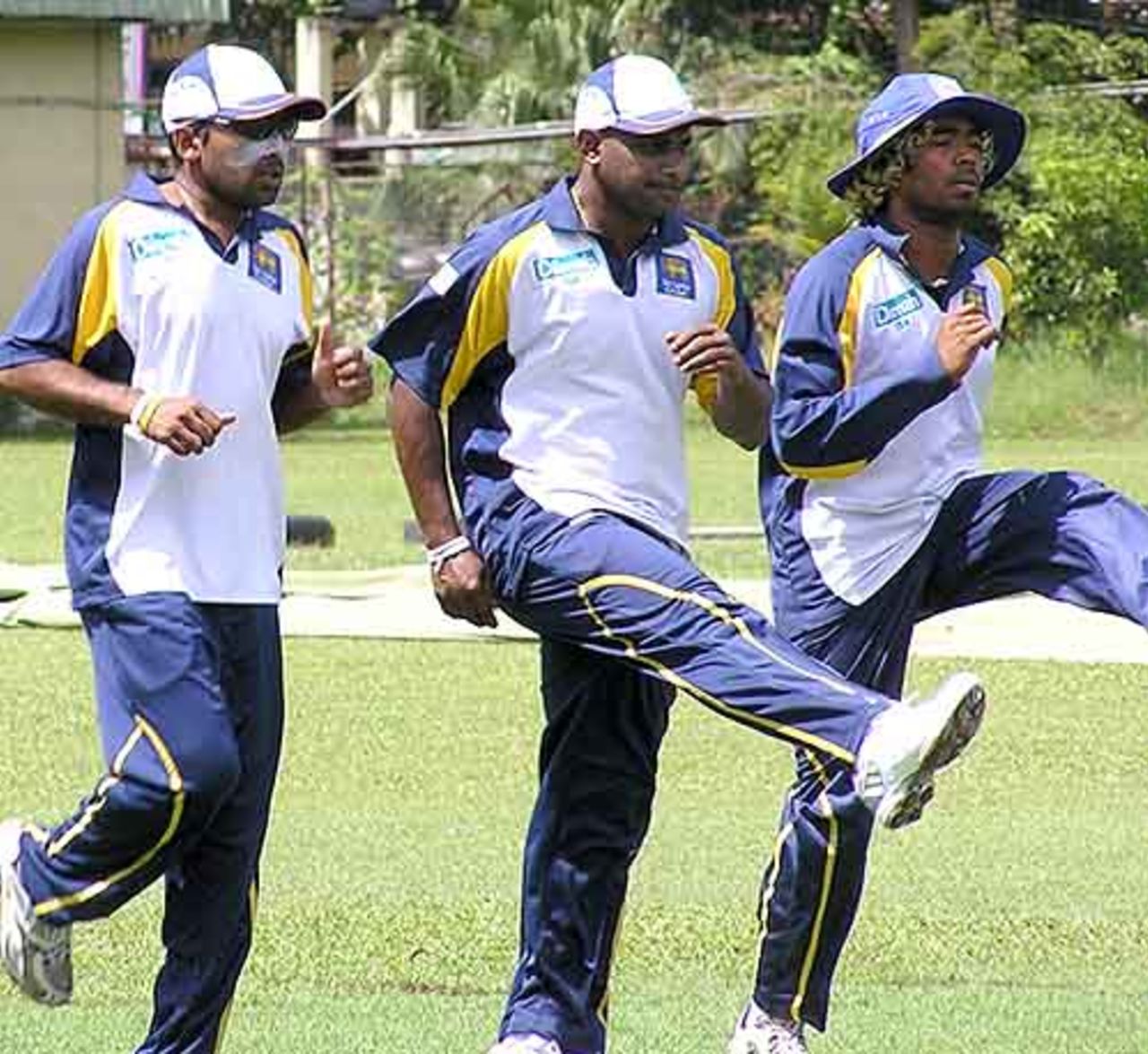 Mahela Jayawardene, Sanath Jayasuriya and Lasith Malinga warm up during practice, Nondescripts Cricket Club, Colombo, September 25, 2007