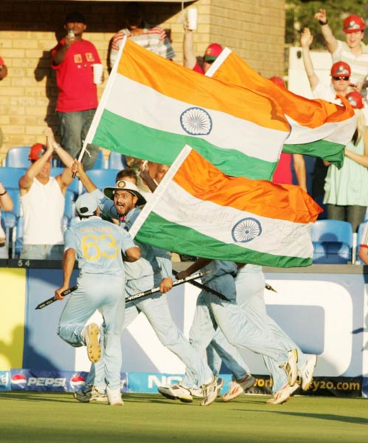 Indian players wave the flags as they run the lap of honour, India v Pakistan, ICC World Twenty20 final, Johannesburg, September 24, 2007