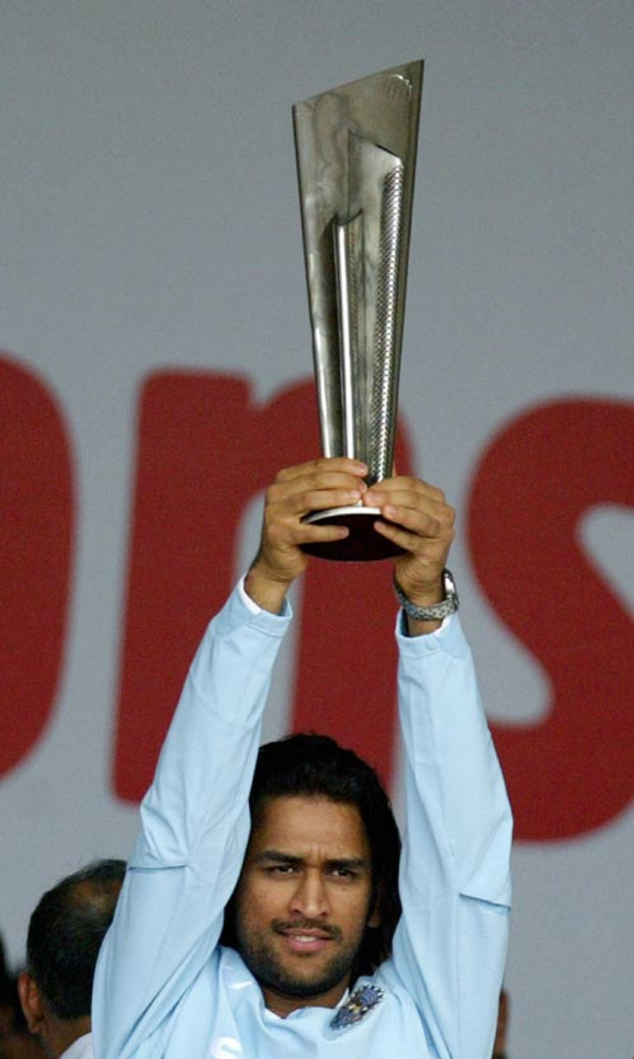 Mahendra Singh Dhoni holds aloft the ICC World Twenty20 trophy at a felicitation ceremony at the Wankhede Stadium, Mumbai, September 26, 2007