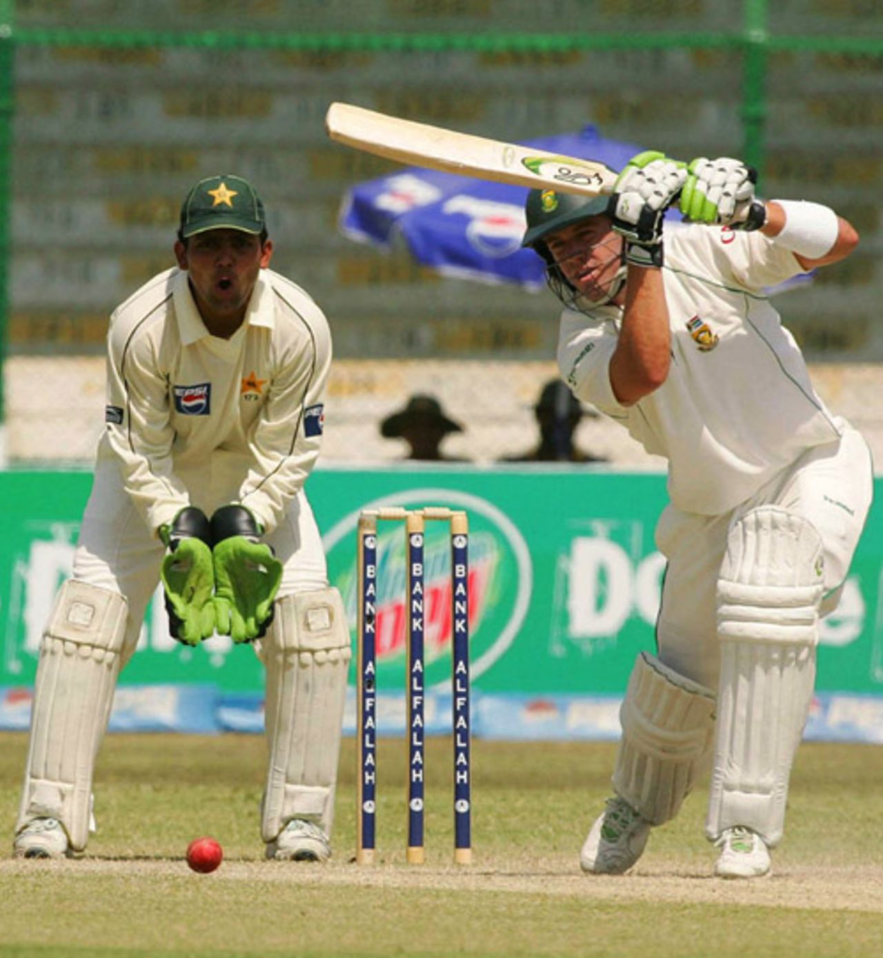 AB de Villiers drives through the offside while Kamran Akmal looks on, Pakistan v South Africa, 1st Test, Karachi, 2nd day, October 2, 2007