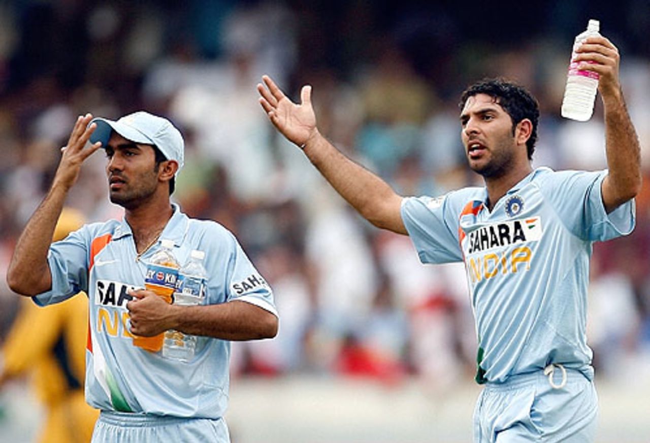 Yuvraj Singh is frustrated while Dinesh Karthik, the 12th man, signals for a towel, India v Australia, 3rd ODI, Hyderabad, October 5, 2007