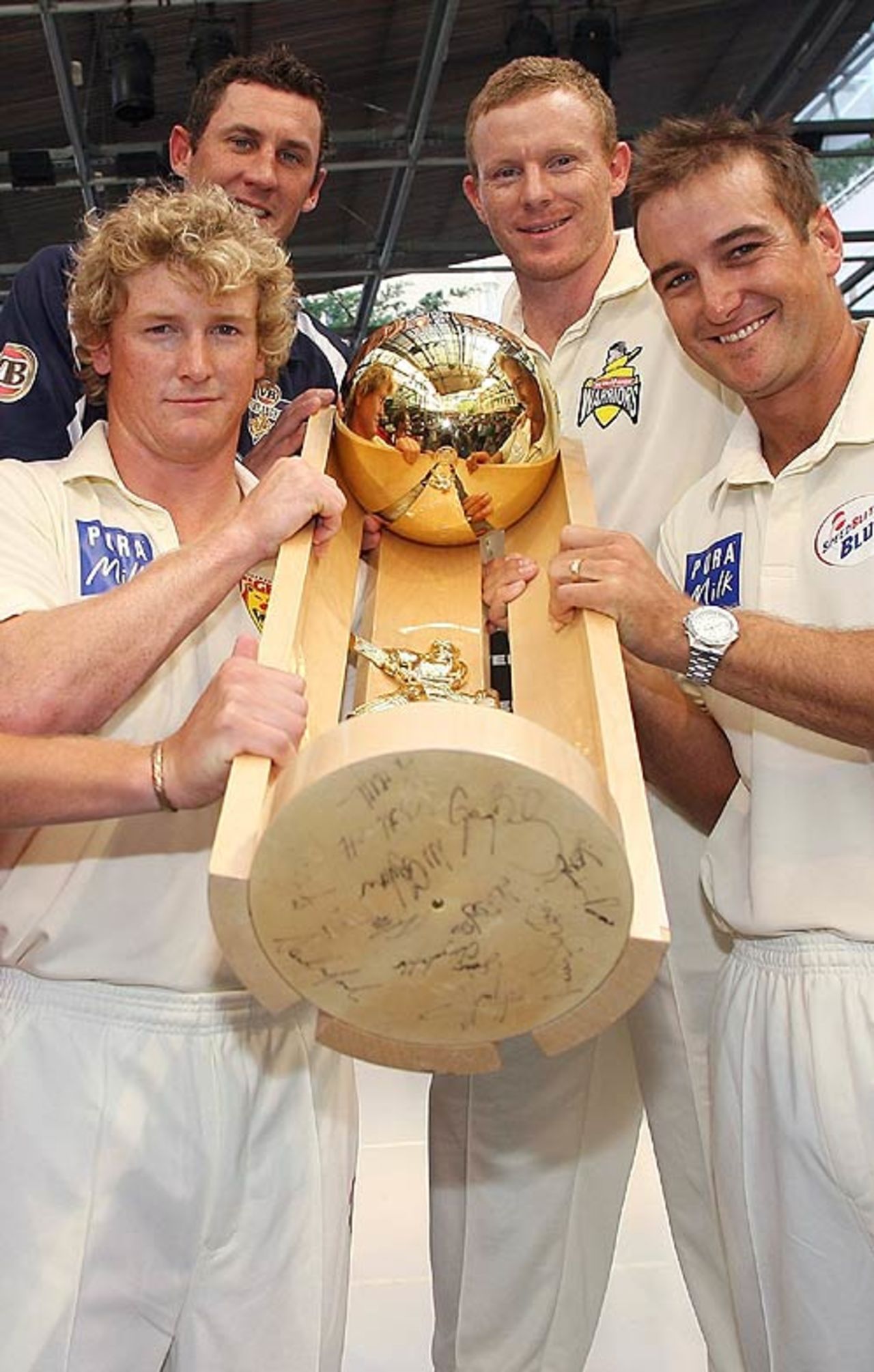 George Bailey, David Hussey, Chris Rogers and Phil Jaques pose with the Pura Cup, Brisbane, October 9, 2007