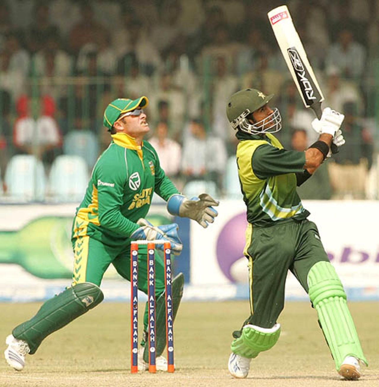 Shoaib Malik and Mark Boucher look on as the ball sails over the boundary, Pakistan v South Africa, 2nd ODI, Lahore, October 20, 2007