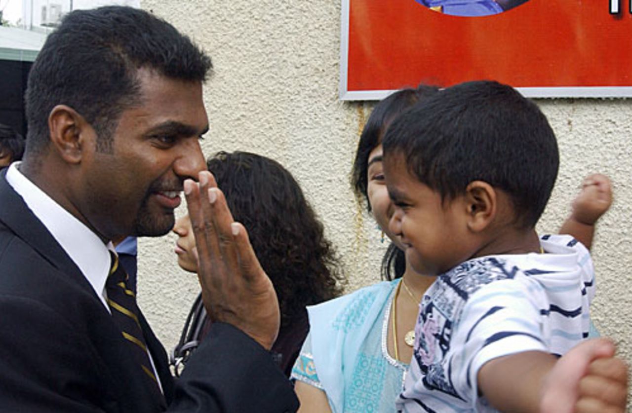 Muttiah Muralitharan plays with his son before leaving for Australia, Colombo, October 23, 2007