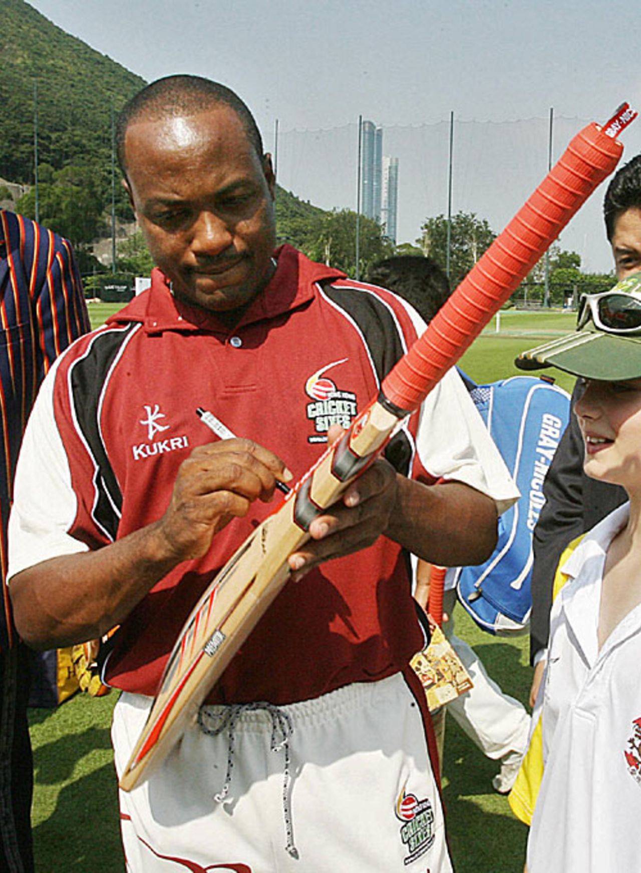 Brian Lara signs autographs at the Hong Kong Cricket Club where he is playing the Hong Kong Sixes tournament, October 25, 2007