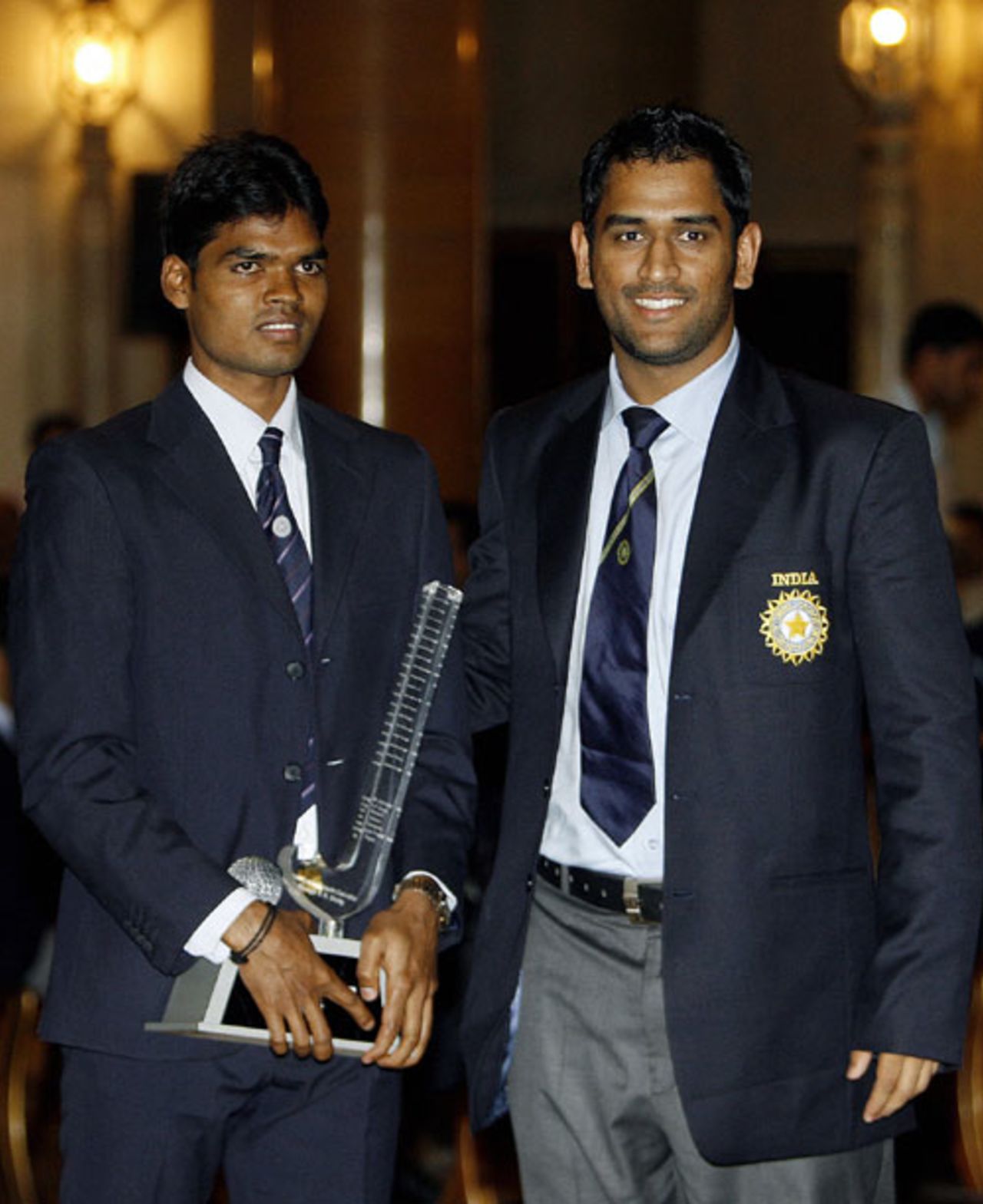 Mahendra Singh Dhoni and Prabodh Tirkey, India's hockey captain, at a function in Delhi, October 30, 2007