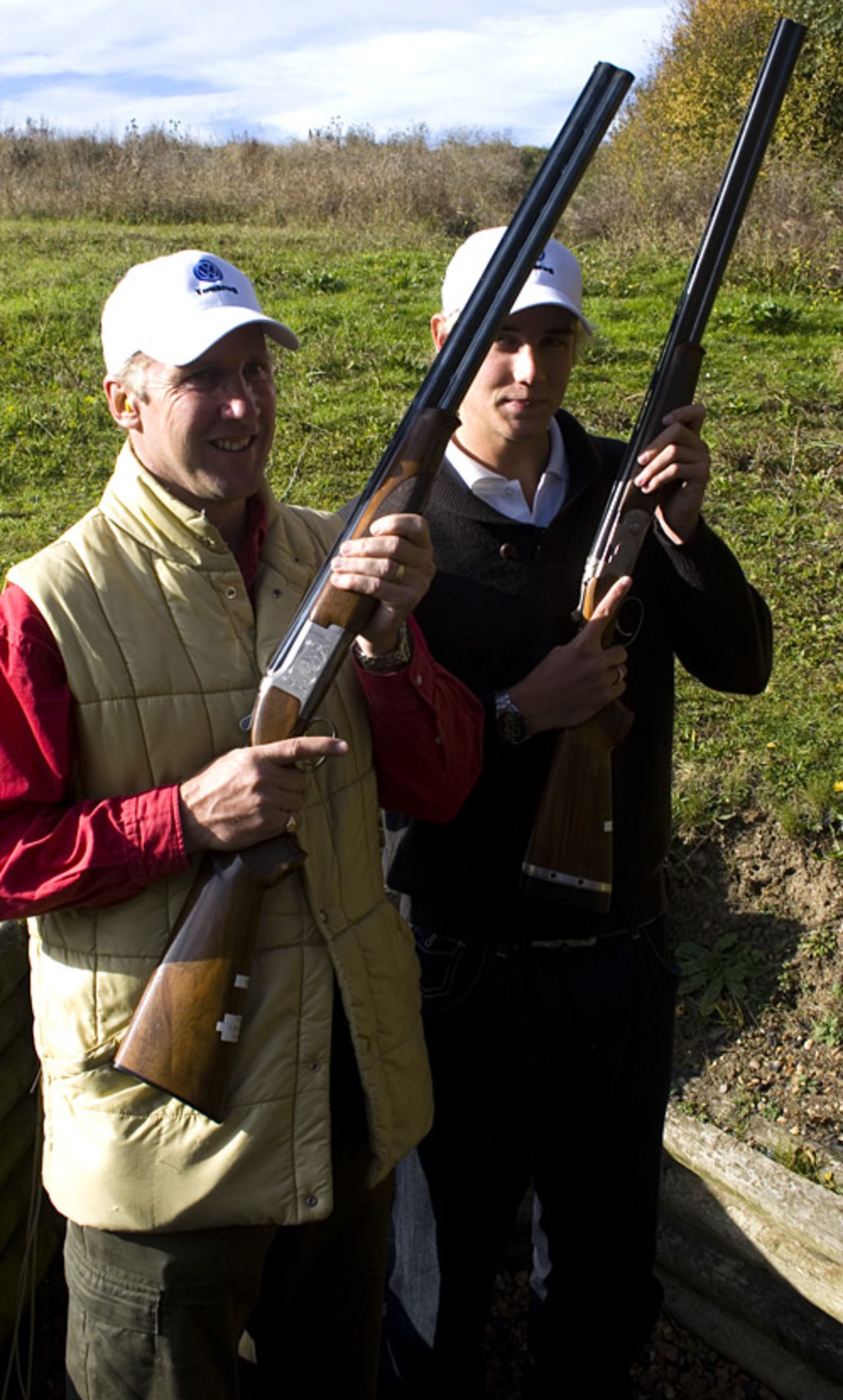 Chris and Stuart Broad pose with shotguns, West London Shooting School, November 1, 2007