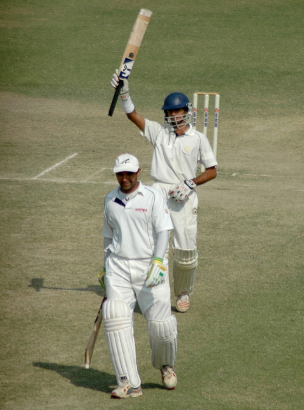Uday Kaul raises his bat upon reaching his century while Pankaj Dharmani looks on, Punjab v Andhra, Ranji Trophy Super League, Group B, 1st round, 3rd day, Amritsar, November 5, 2007 