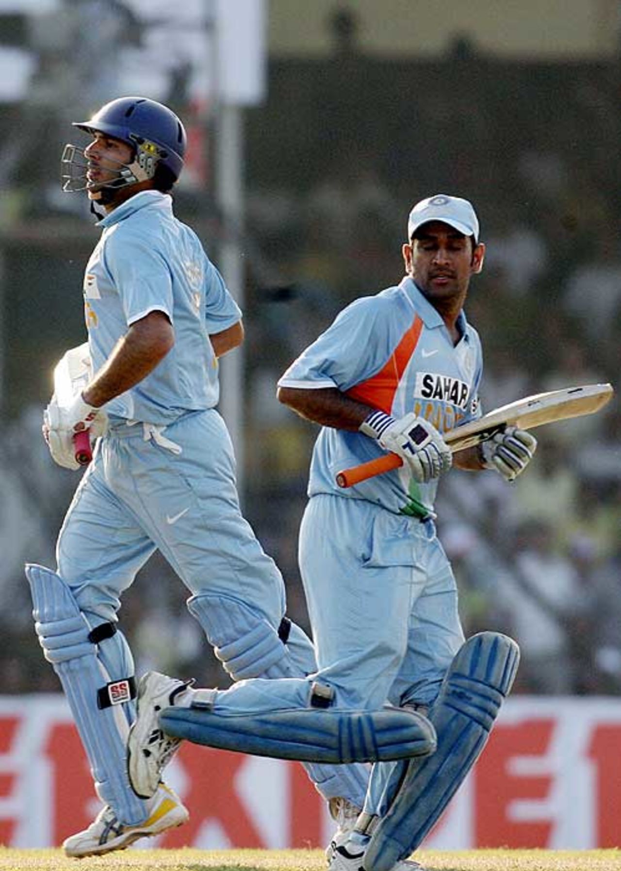 Yuvraj Singh and MS Dhoni take a single during their century partnership, India v Pakistan, 1st ODI, Guwahati, November 5, 2007