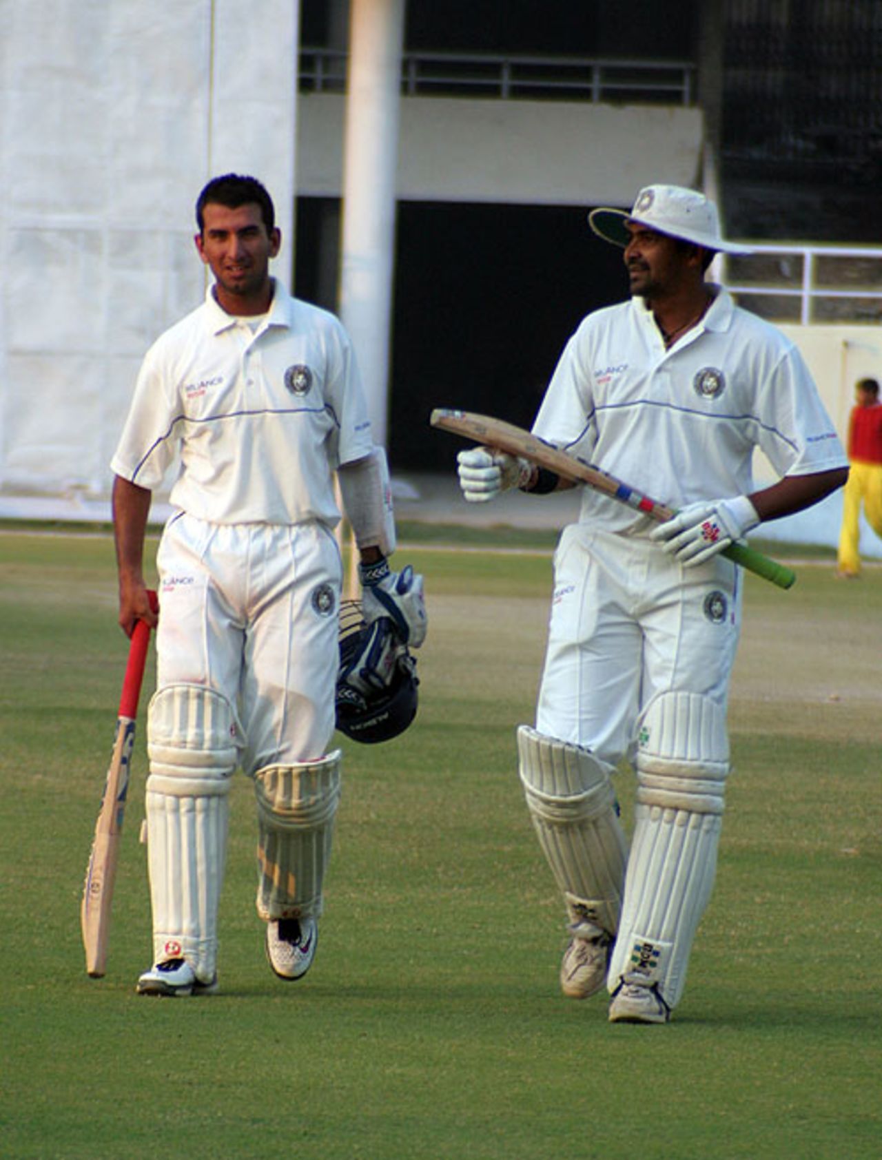Cheteshwar Pujara and Rakesh Dhurv leave the field, Himachal Pradesh v Saurashtra, Ranji Trophy Super League, Group A, 1st round, 3rd day, Dharamsala, November 5, 2007 
