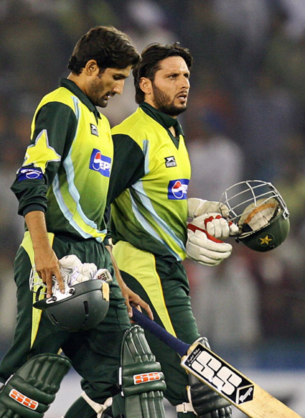 Sohail Tanvir and Shahid Afridi walk back after winning the match, India v Pakistan, 2nd ODI, Mohali, November 8, 2007