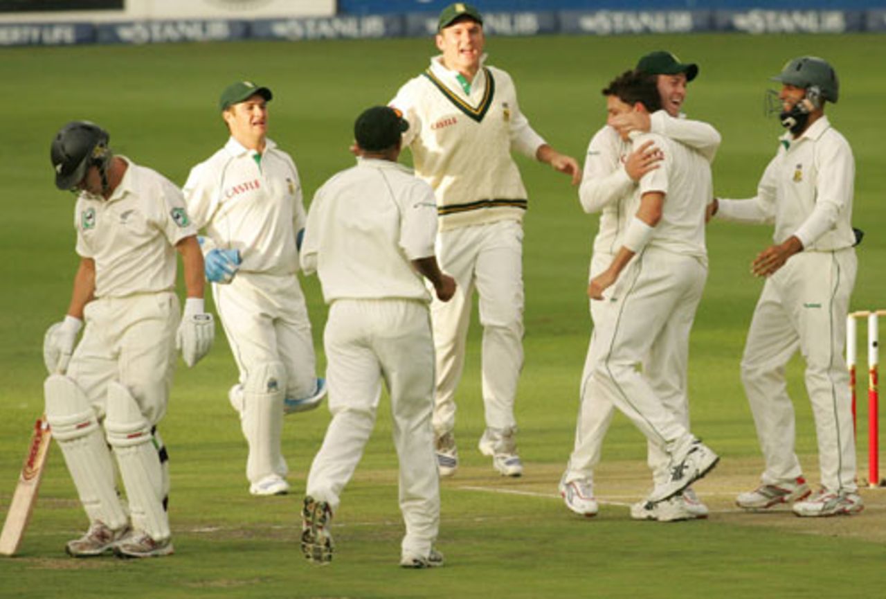 Dale Steyn is mobbed by his team-mates after dismissing Craig Cummings, South Africa v New Zealand, 1st Test, Johannesburg, 1st day, November 8, 2007