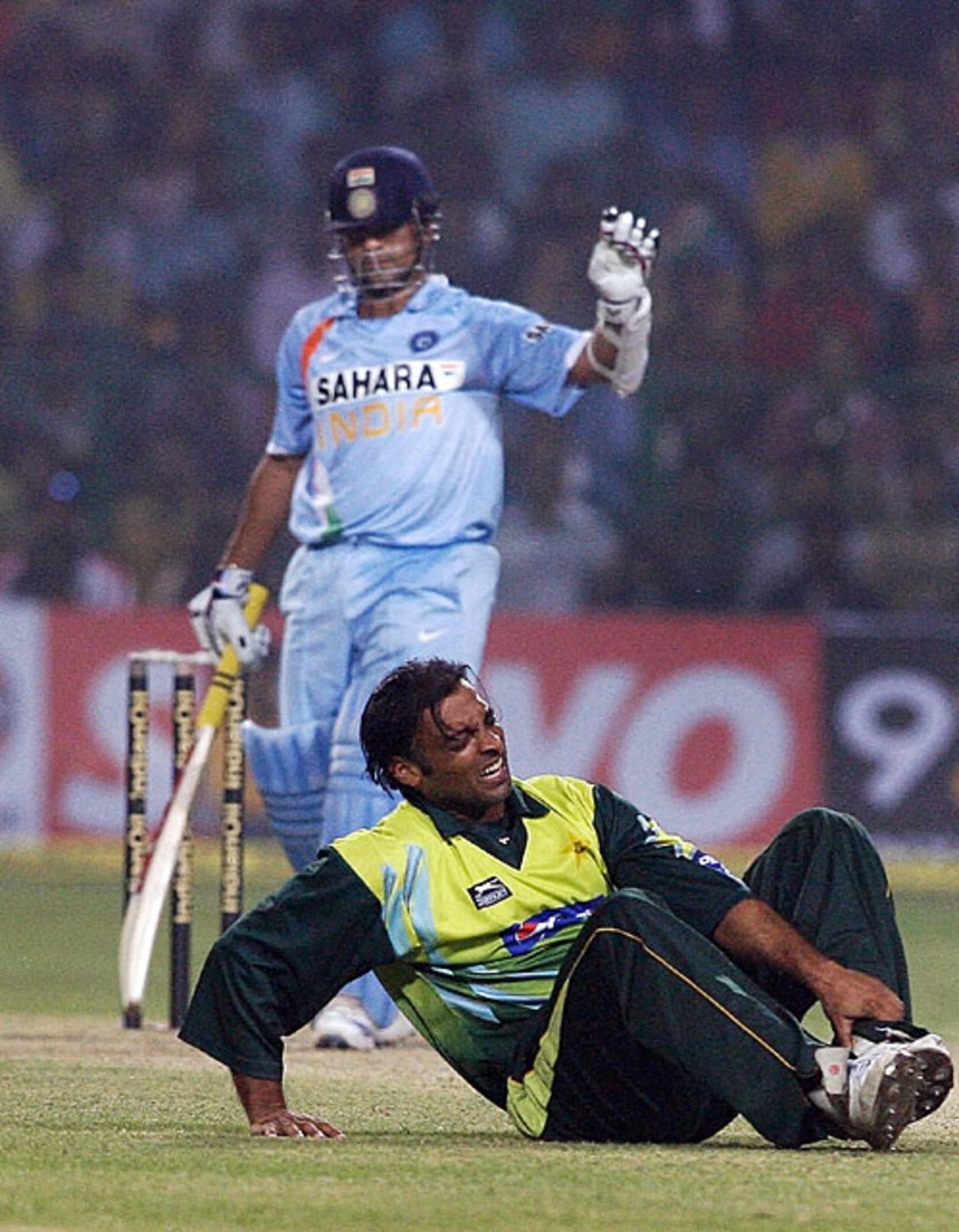 Shoaib Akhtar clutches his foot in pain after the ball, off Sachin Tendulkar's bat, collided with his foot, India v Pakistan, 4th ODI, Gwalior, November 15, 2007
