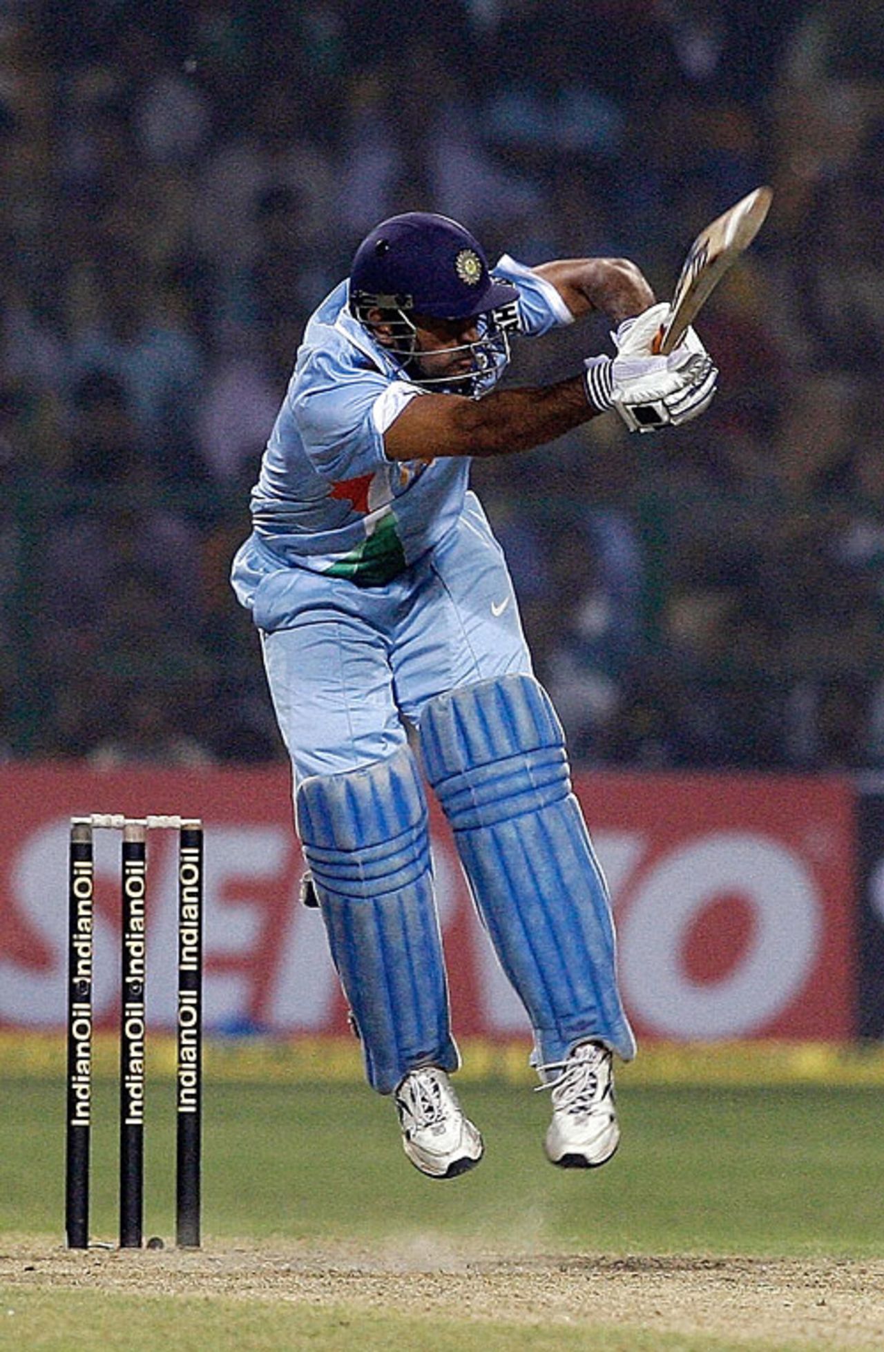 Mahendra Singh Dhoni plays an unorthodox shot to the leg side , India v Pakistan, 4th ODI, Gwalior, November 15, 2007