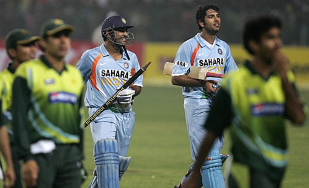 Mahendra Singh Dhoni and Yuvraj Singh walk back after winning the fourth ODI by six wickets, India v Pakistan, 4th ODI, Gwalior, November 15, 2007