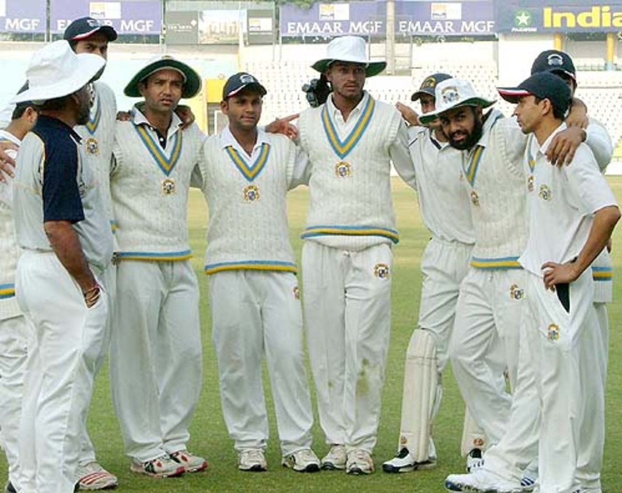 The Punjab players huddle up before the start of Uttar Pradesh's innings, Punjab v Uttar Pradesh, Ranji Trophy Super League, Group B, 3rd round, 2nd day, Mohali, November 24, 2007