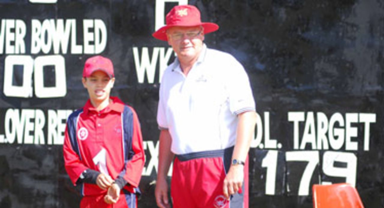 Father and son - Mark Chapman captains the Hong Kong Under-15 team under the watchful eye of his father Peter 