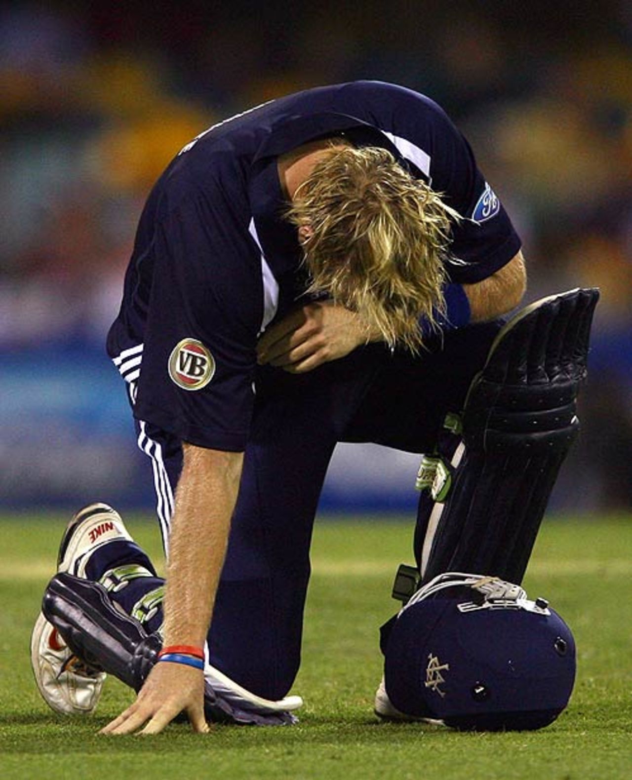Cameron White crouches in pain after breaking a bone in his foot, Queensland v Victoria, FR Cup, Brisbane, November 23, 2007