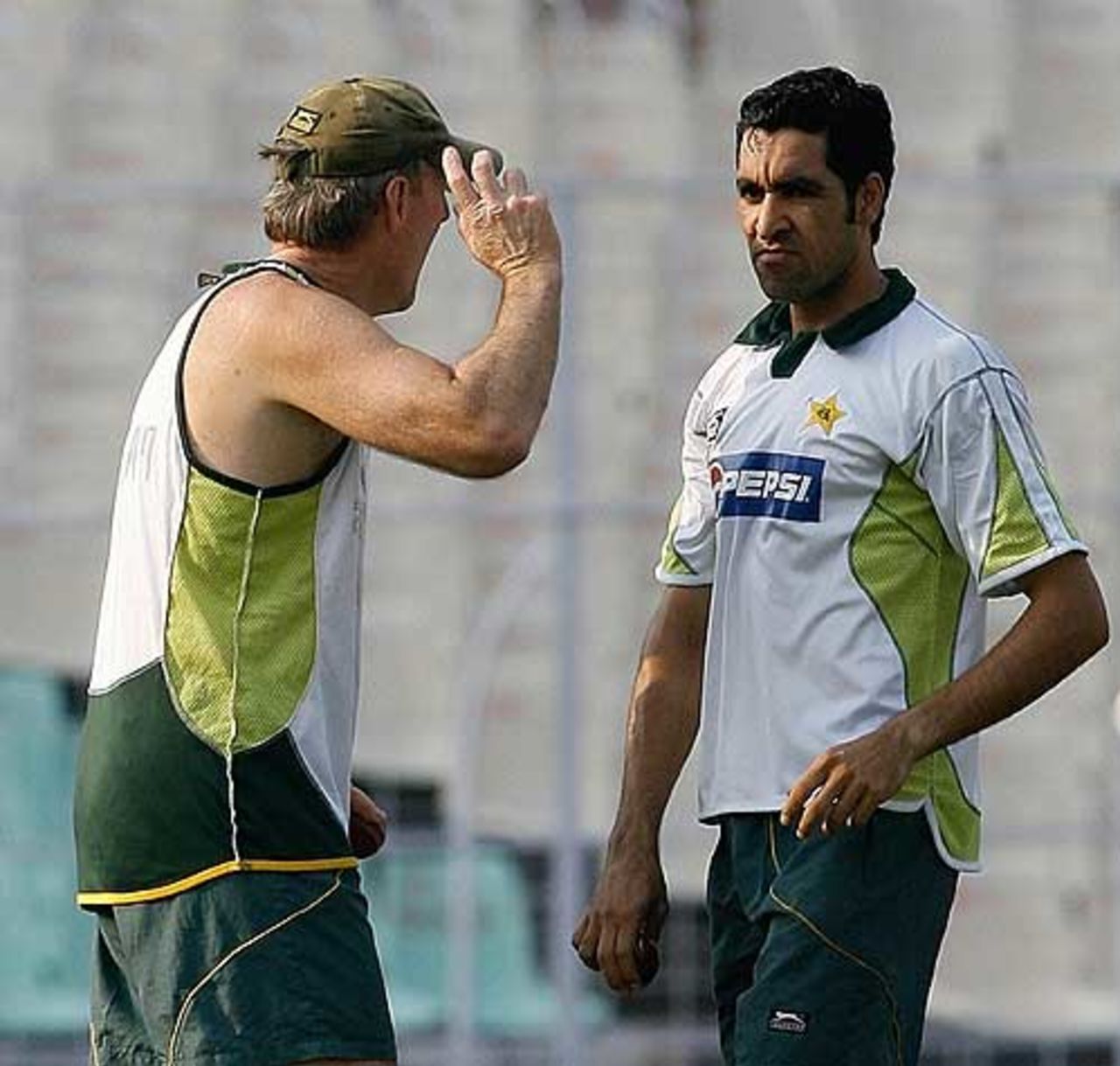Advice from the coach as Umar Gul practices in the nets, Kolkata, November 28. 2007