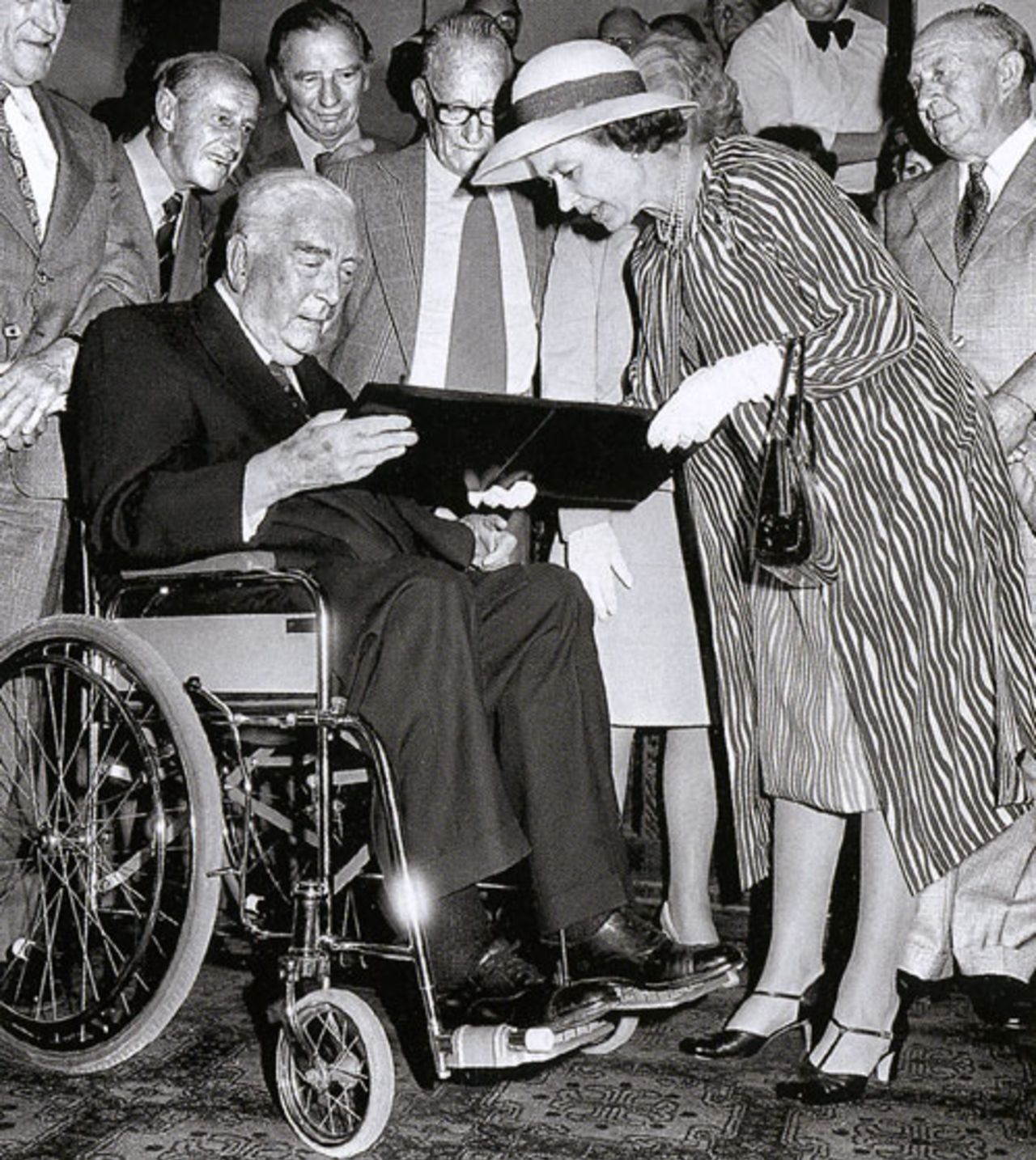 Queen Elizabeth presents Sir Robert Menzies with the Order of Australia during the Centenary Test, Melbourne, March 23, 1977
