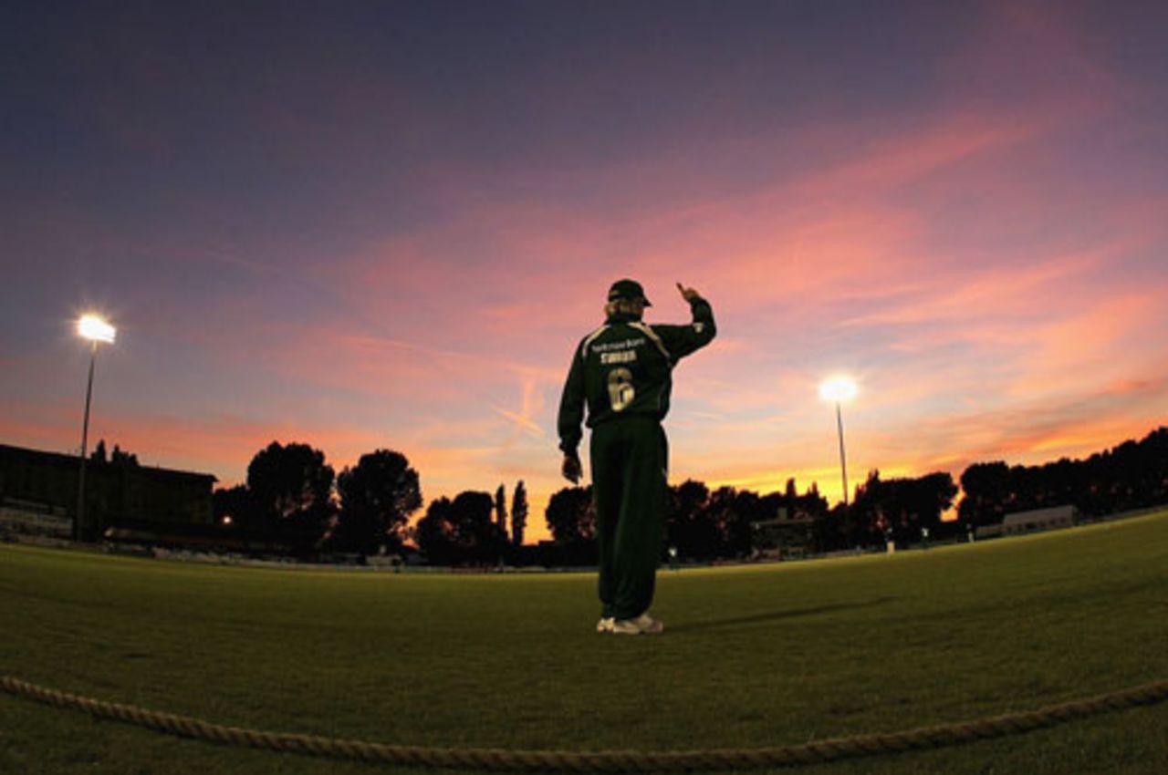 Graeme Swann stands on the boundary as the sun goes down, Derbyshire v  Nottinghamshire, Derby, June 2, 2007