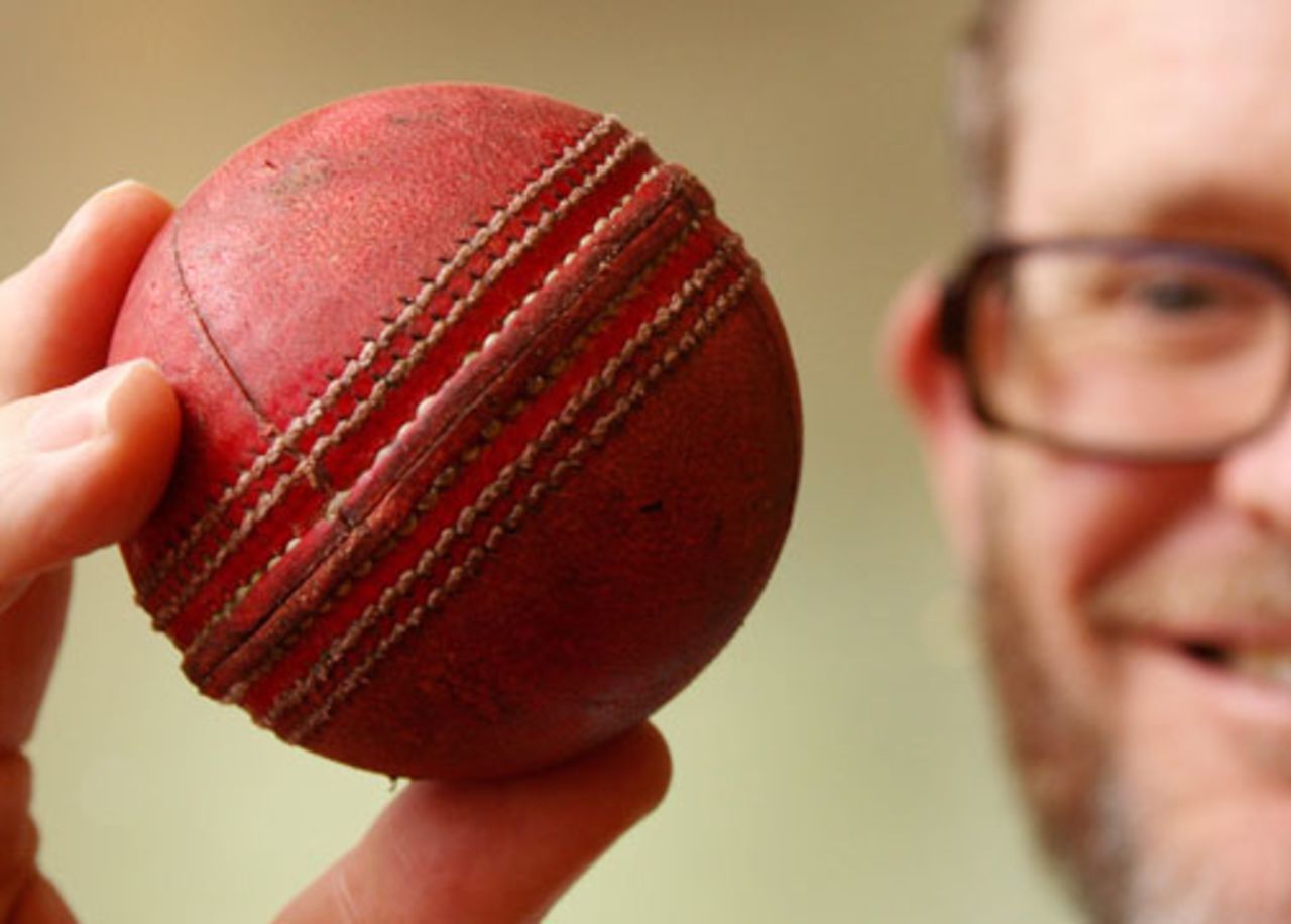 Peter Young of Cricket Australia holds up the ball that Australian batsman Adam Gilchrist hit for his 100th Test six, a world record, Melbourne, December 5, 2007