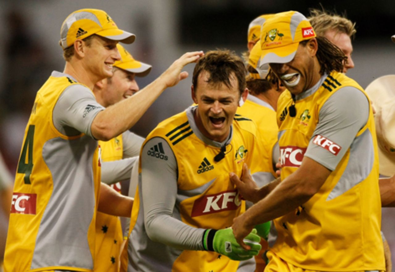 Adam Gilchrist is given the treatment after taking a catch, Australia v New Zealand, Twenty20 International, Perth, December 11, 2007 
