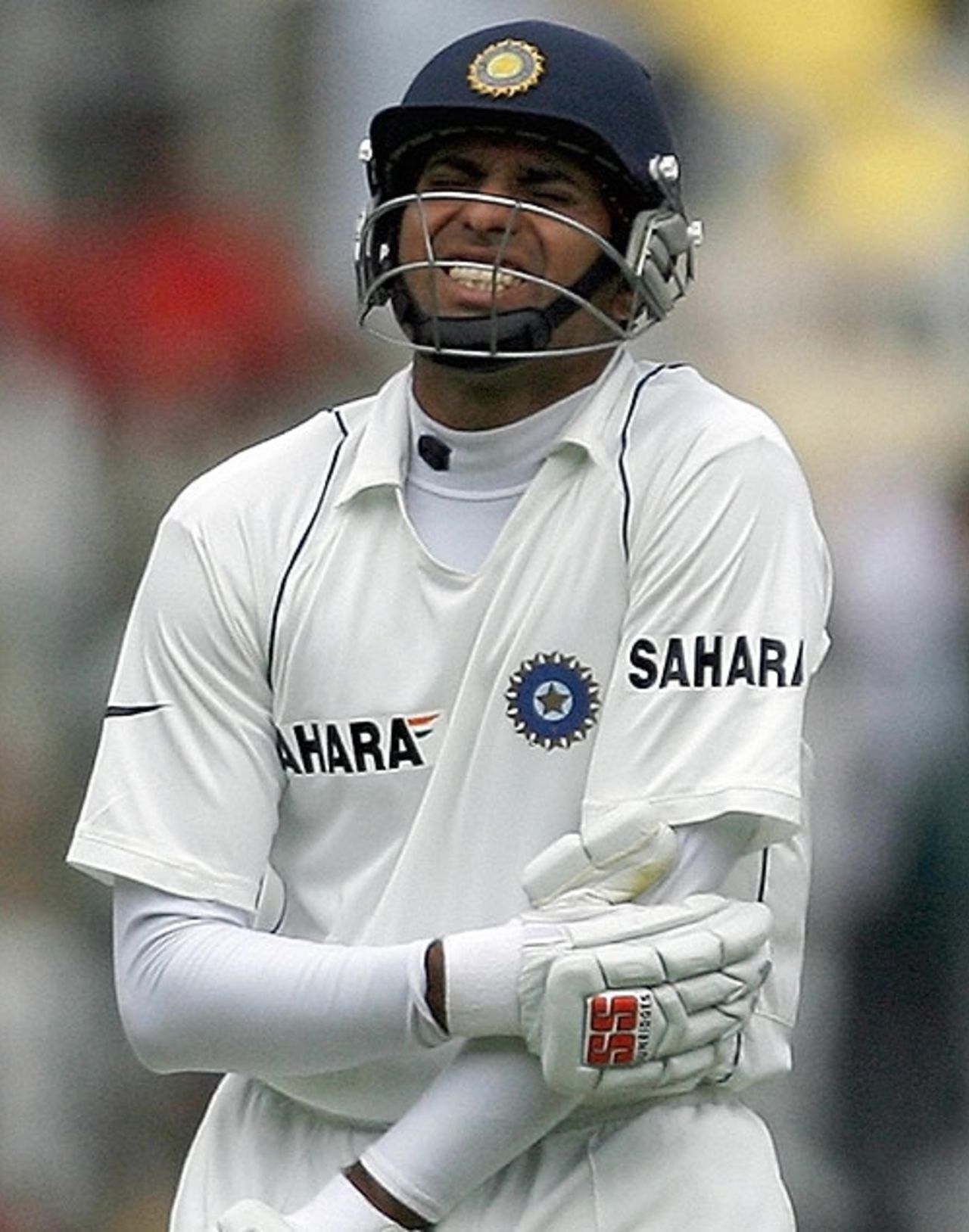 VVS Laxman winces in pain after a bouncer struck his left elbow, India v Pakistan, 3rd Test, Bangalore, 5th day, December 12, 2007 

