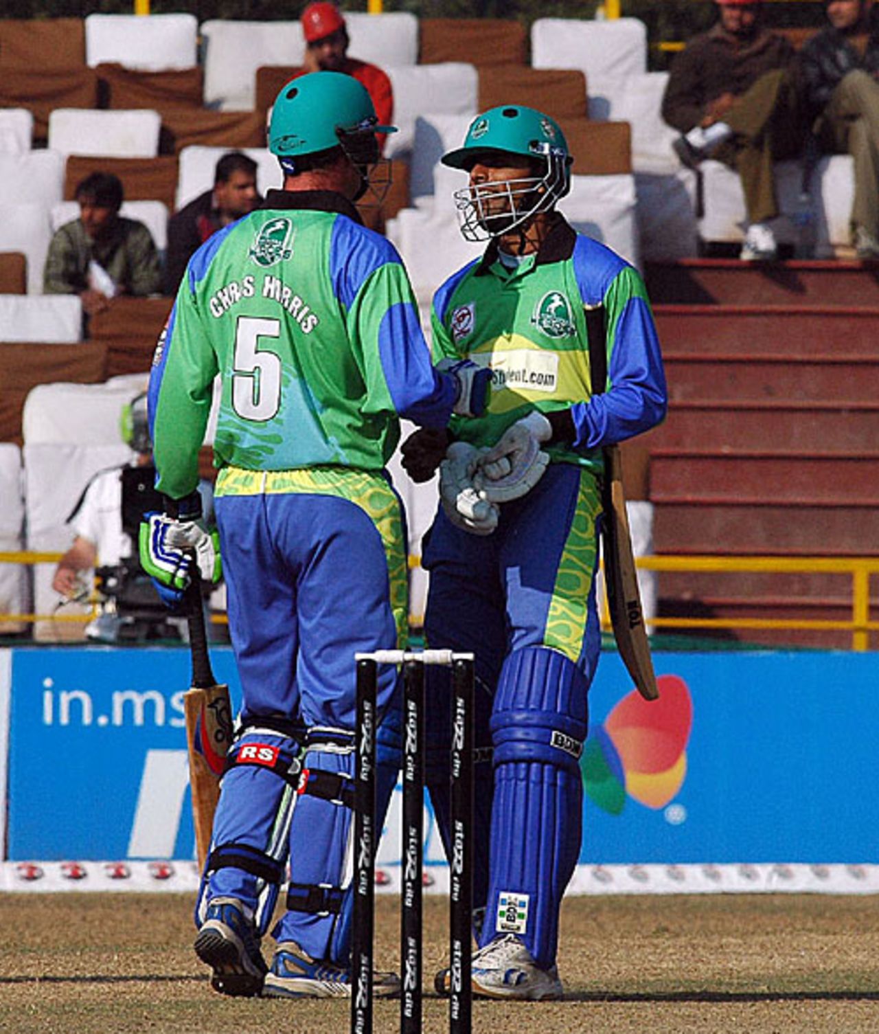 Chris Harris congratulates Abdul Razzaq on reaching his half-century, Hyderabad Heroes v Mumbai Champs, Indian Cricket League, Panchkula, December 15, 2007