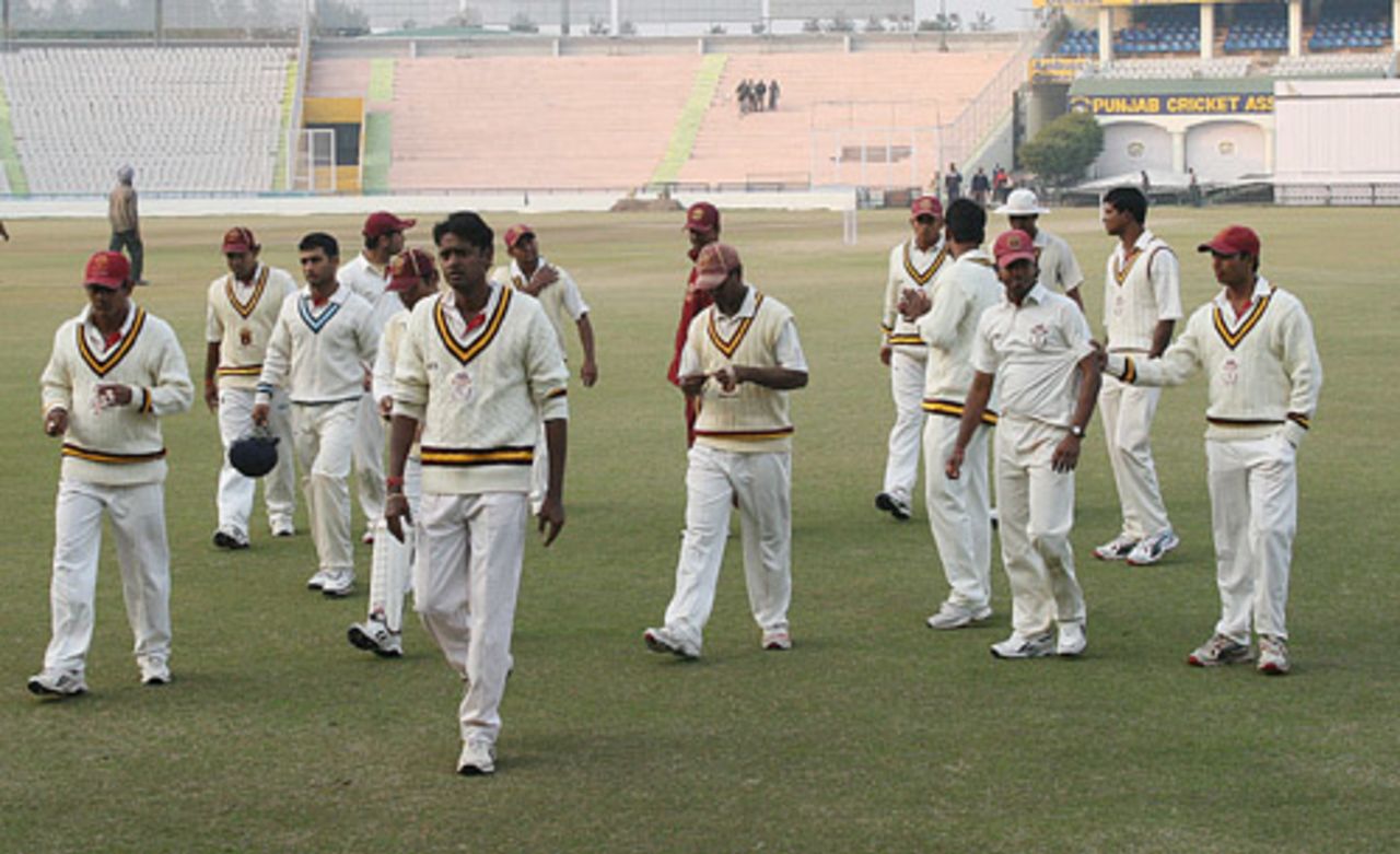 Debasis Mohanty and the rest of the Orissa team leave the field after the 3rd day's play, Punjab v Orissa, Ranji Trophy Super League, Group A, 6th round, Chandigarh, 3rd day, December 19, 2007 