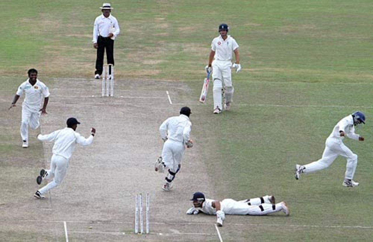Sri Lanka celebrate as Ravi Bopara lies disconsolate after being run out first ball, Sri Lanka v England, 3rd Test, Galle, 5th day, December 22 2007