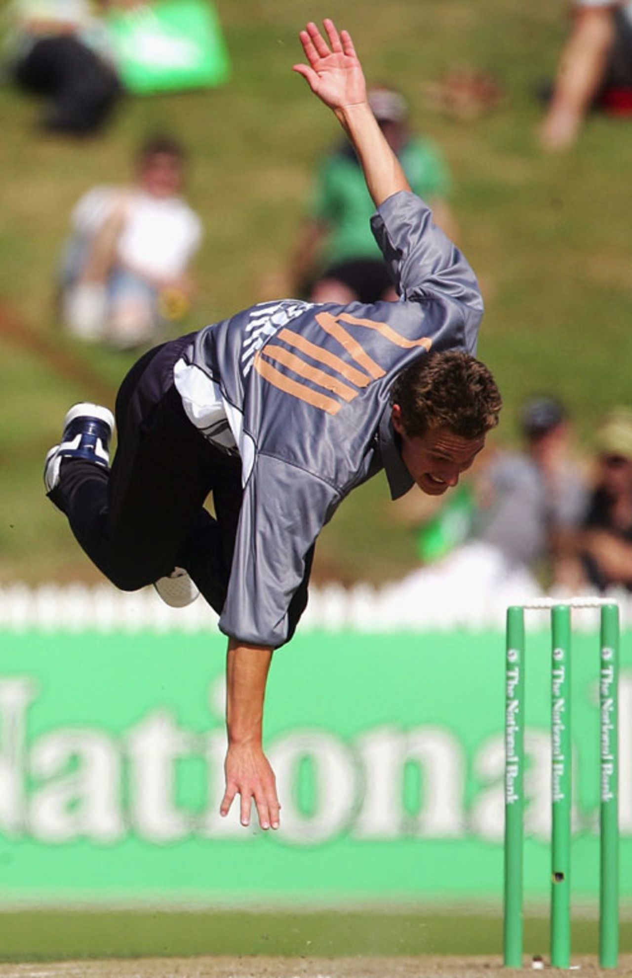 Greg Morgan goes airborne during his follow through, NZCPA Masters XI v New Zealand Under-19, Twenty20 match, Seddon Park, Hamilton, December 23, 2007